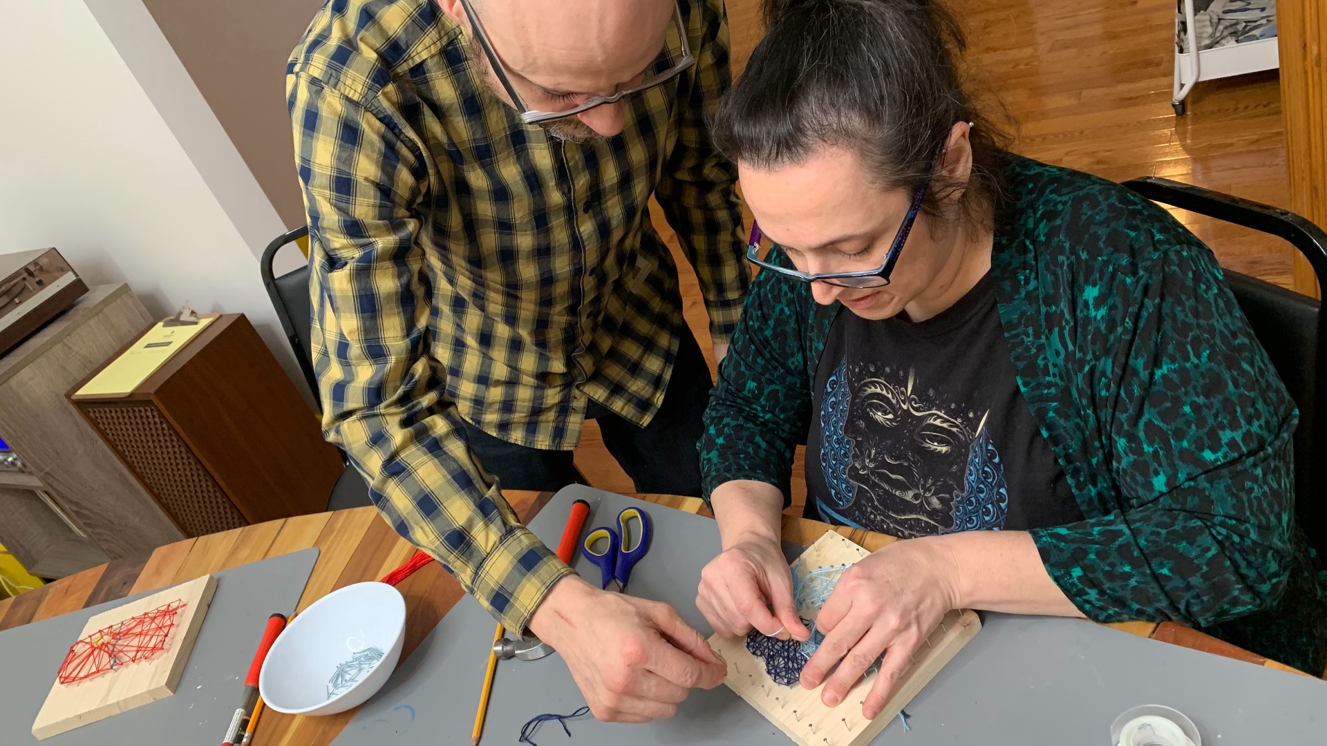 Horst Arts helps guests create a variety of fun crafts. They are holding two Valentine's-Day-themed string art sessions.