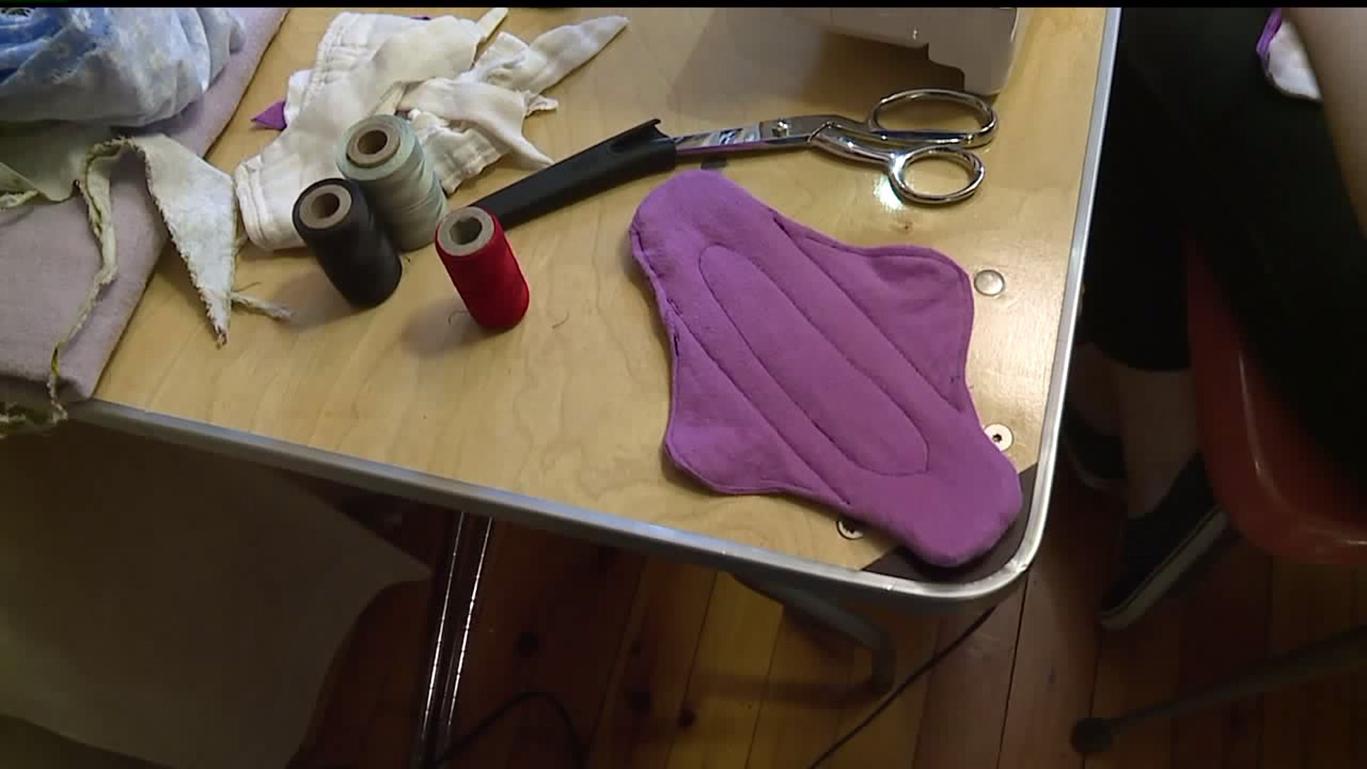 Volunteers make reusable menstral pads to end period poverty