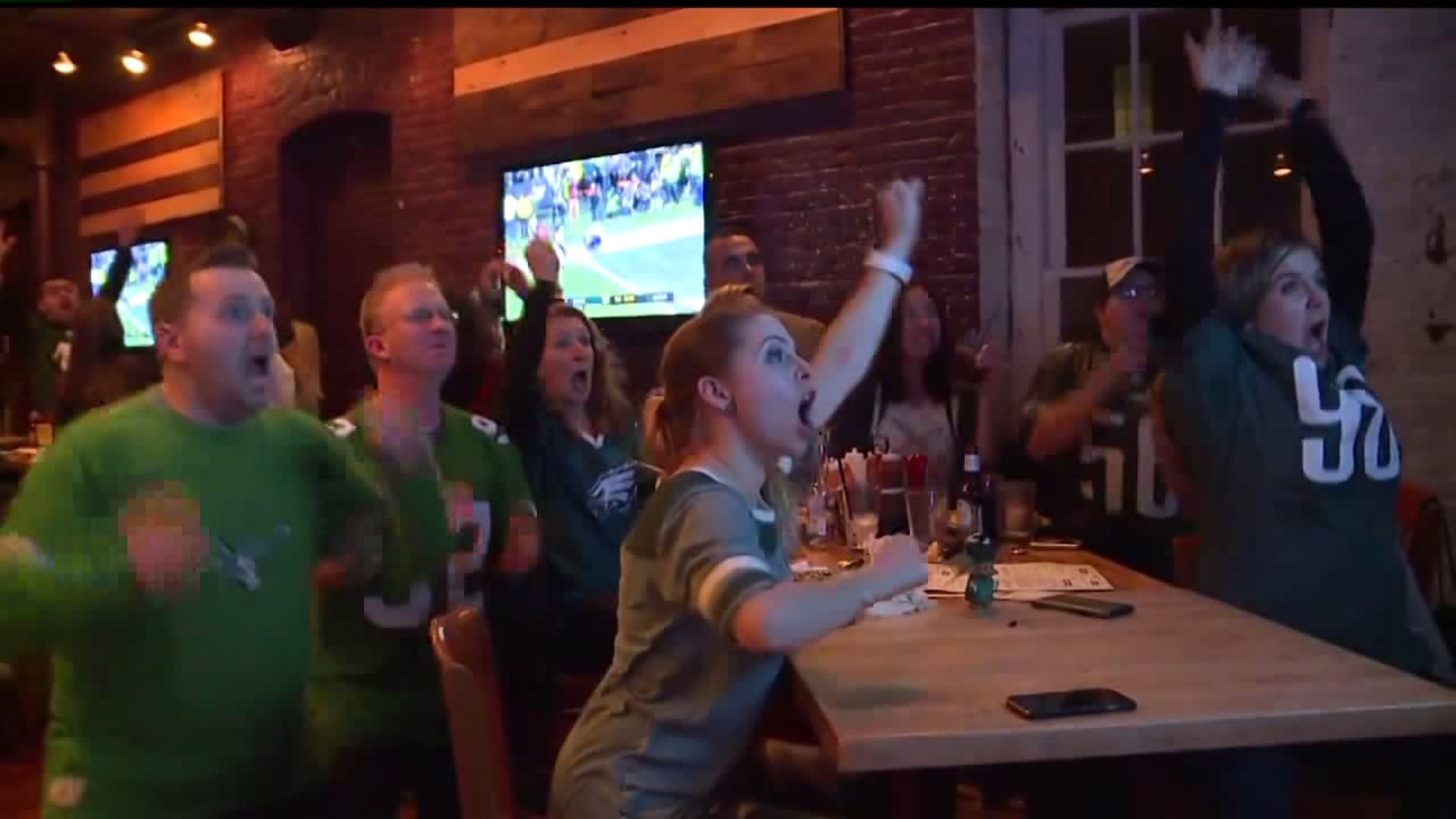 Eagles fans cheer on their team in the NFC Championship