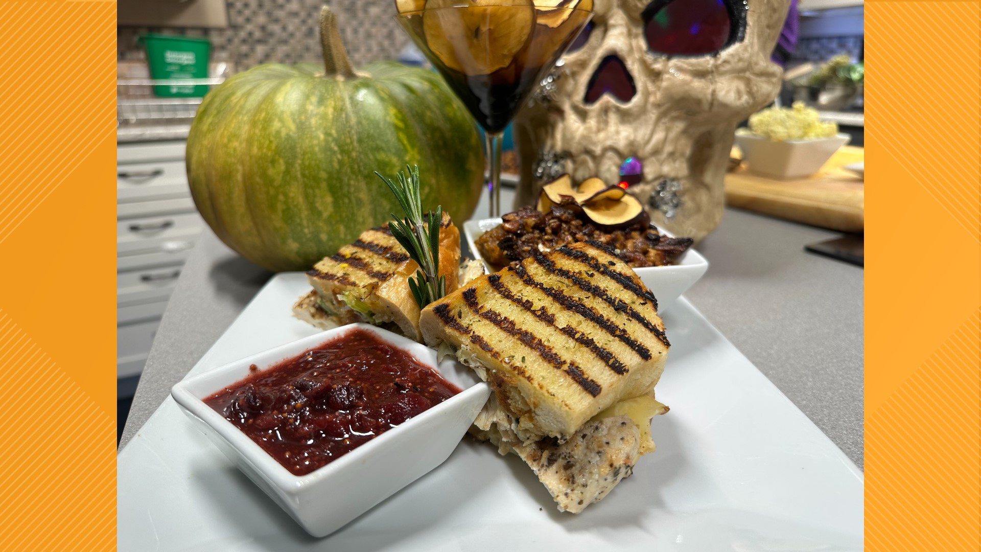 Olivia's delicious Chicken Dinner Melt sandwich, served with a cranberry Dijon spread and a savory pumpkin casserole, embraces fall flavors.