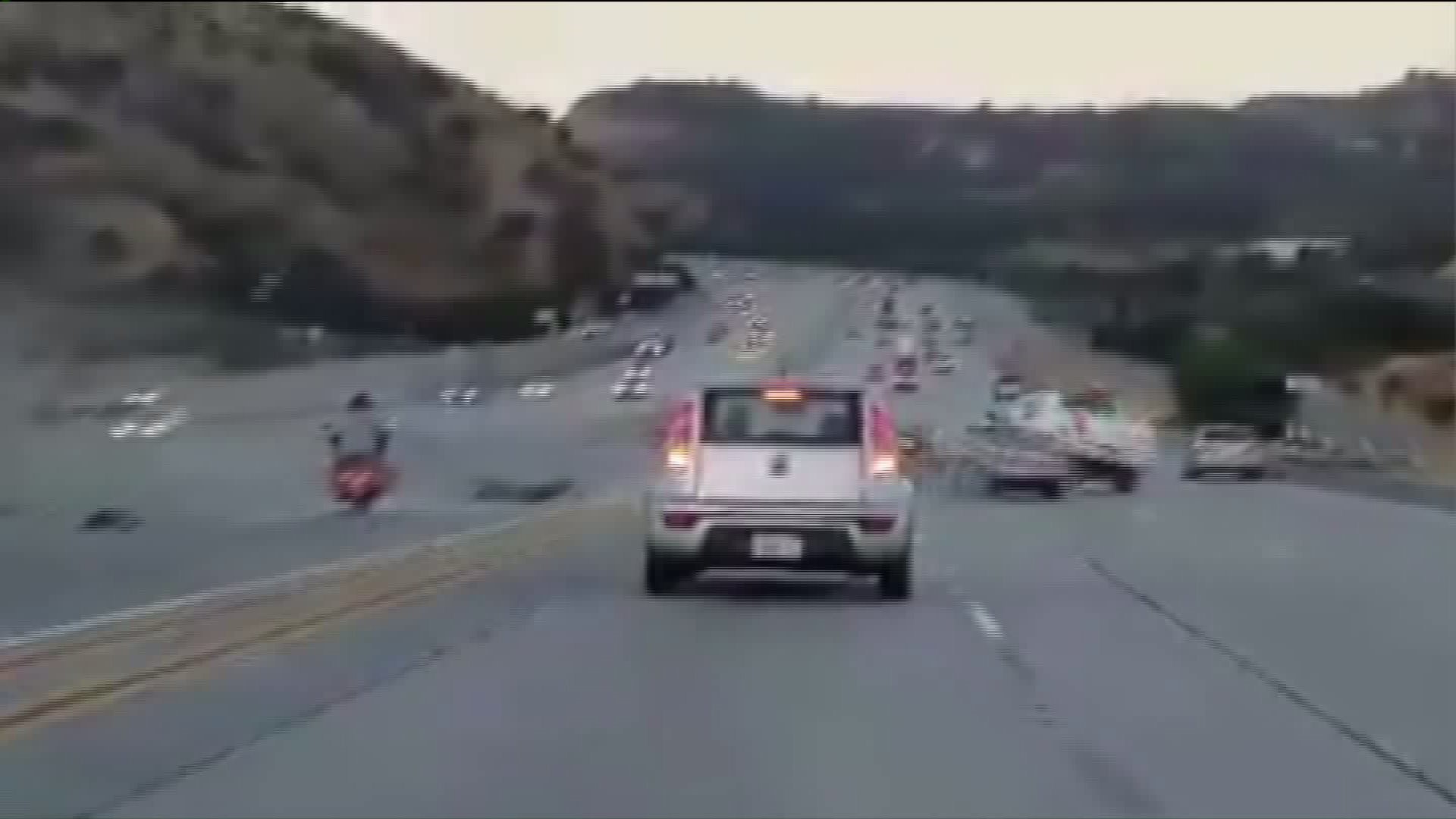 Motorcyclist kicks car in road rage incident, triggers chain-reaction ...