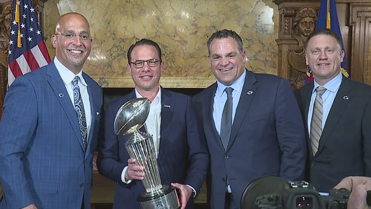 Penn State coaches bring the Rose Bowl trophy to the Harrisburg State Capitol