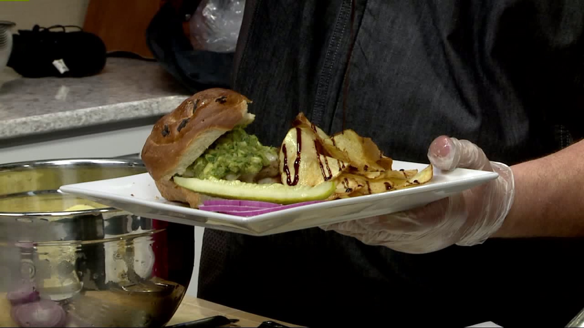 Olivia`s prepares a fire-grilled turkey burger topped with a guacamole spread