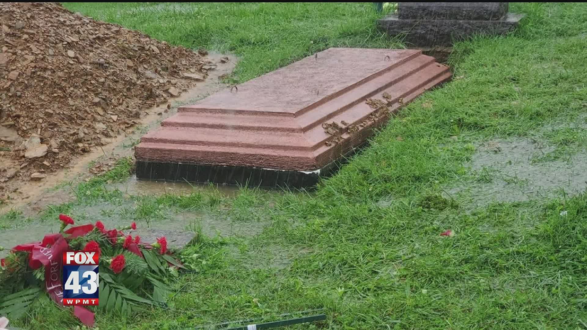 A picture that made its rounds on social media showing a flooded burial vault has many people wondering who is responsible.