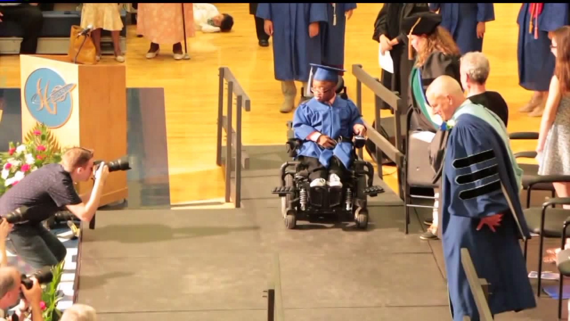 Student with rare genetic disorder walks at graduation