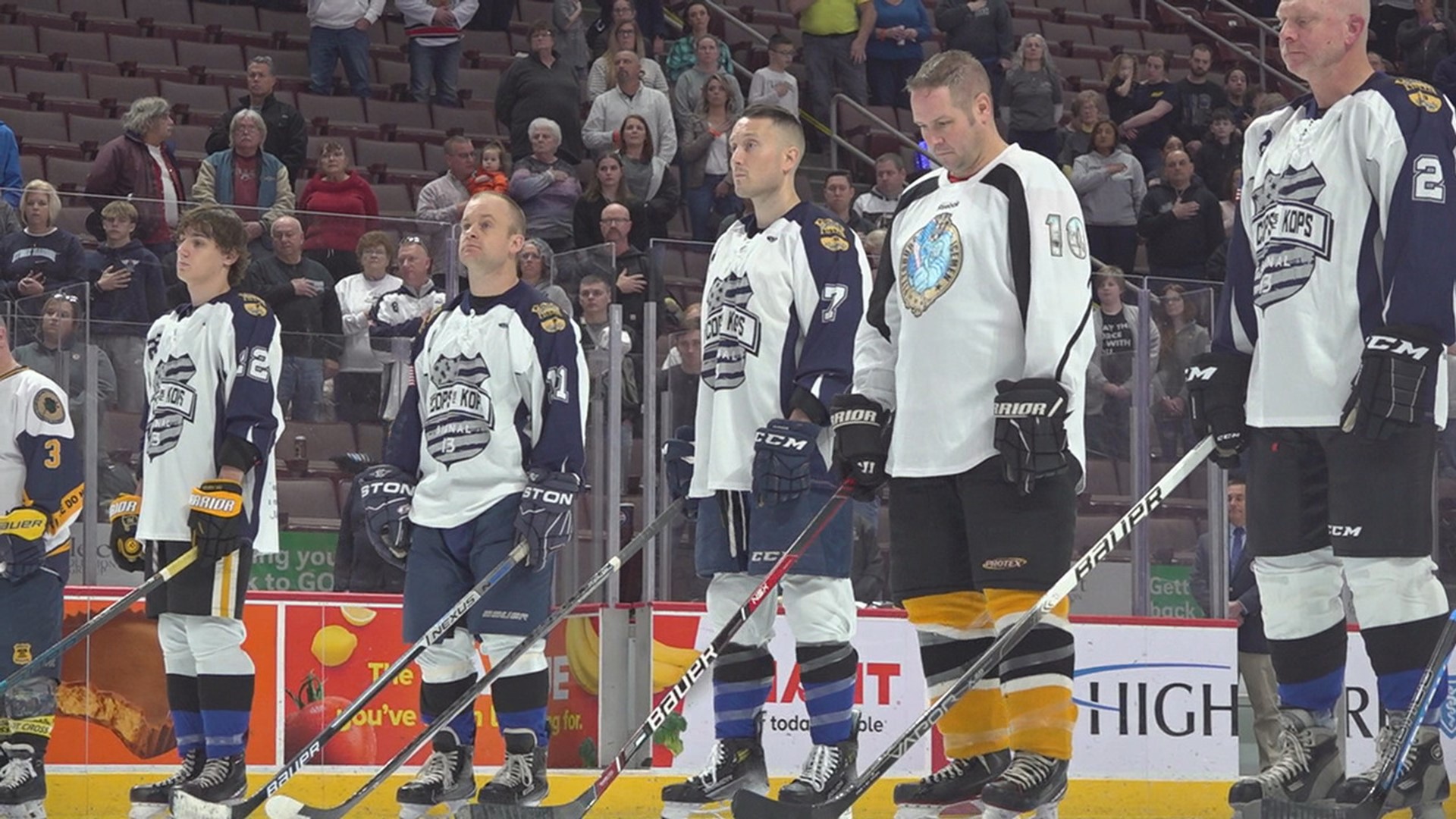 The charity hockey game raises money for families of fallen police officers.