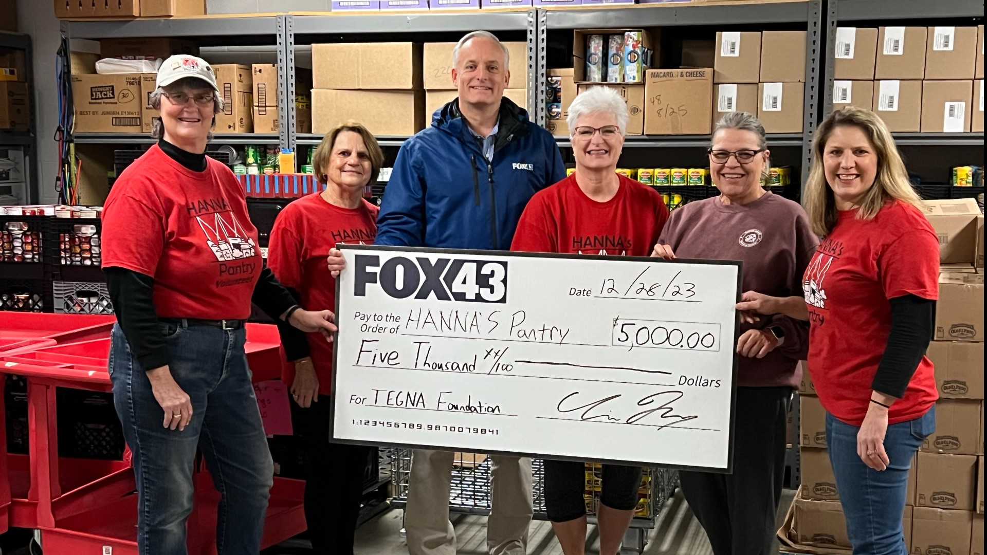 Chris Topf, FOX43's president and general manager, presented Hanna's Pantry with a $5,000 check courtesy of the TEGNA Foundation.