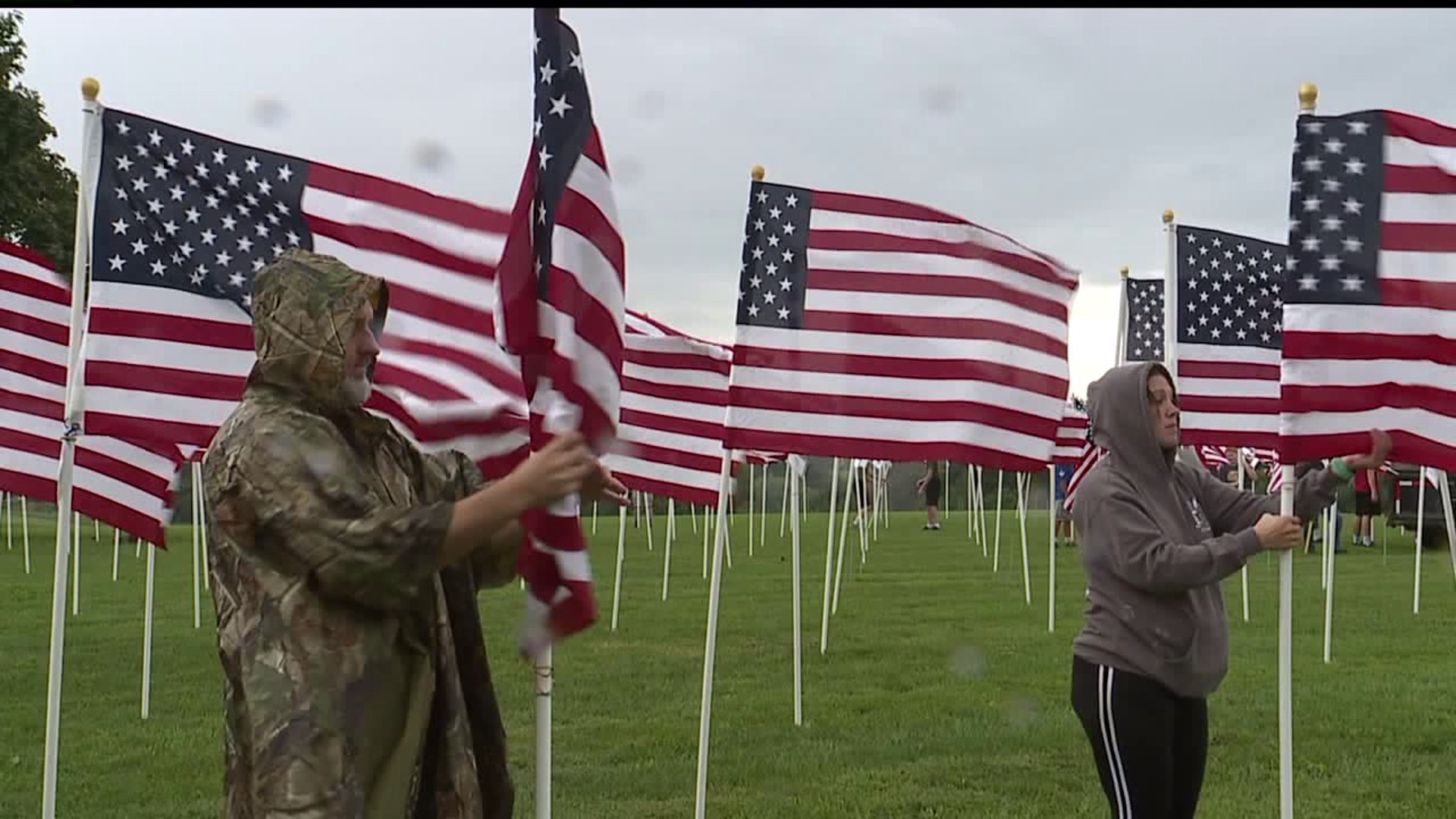 Volunteers set up 1,000 flag display outside of the West Manheim Elementary School