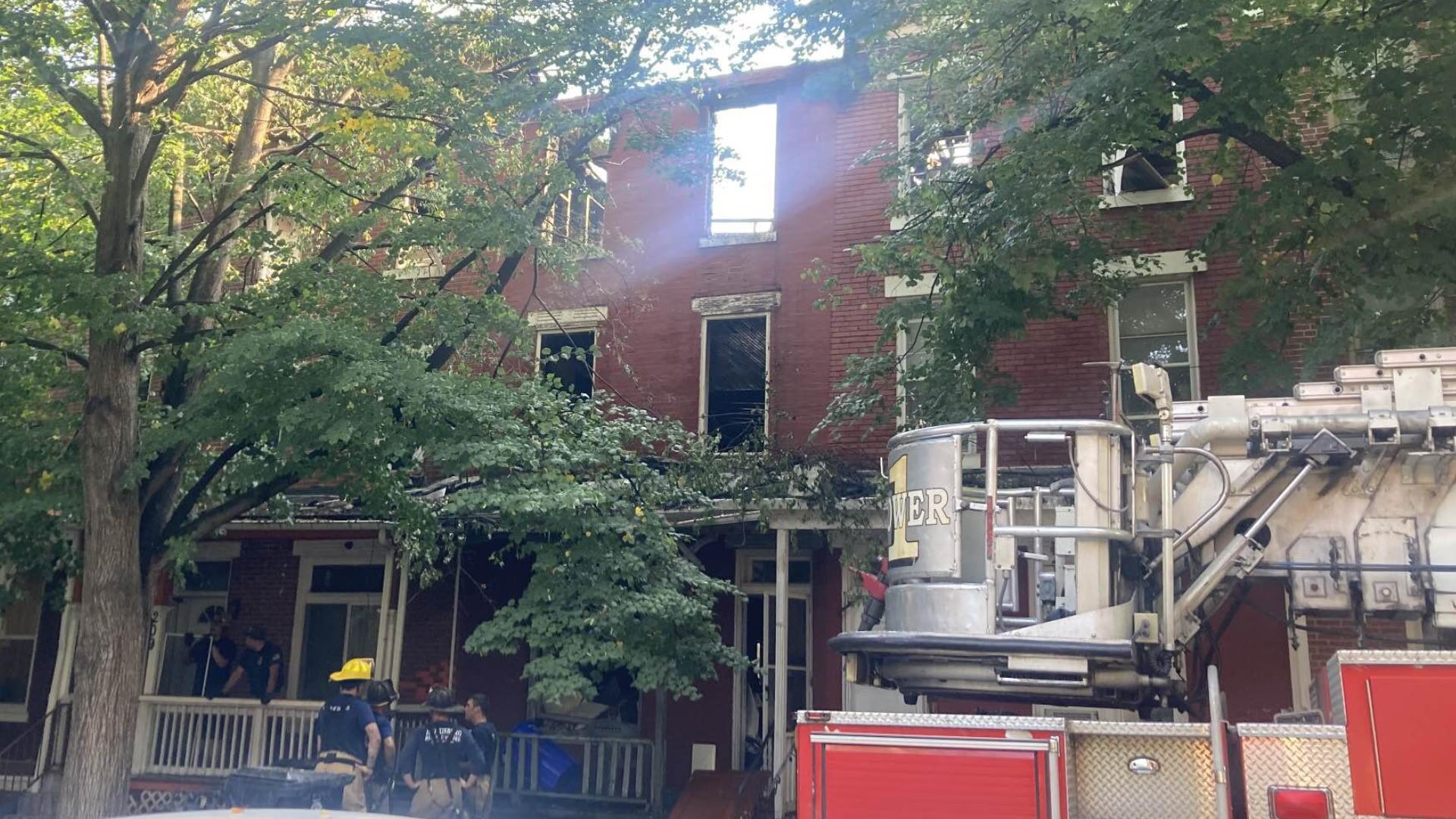 One person is dead and eight are displaced after a Harrisburg fire that saw three apartment units go up in flames.