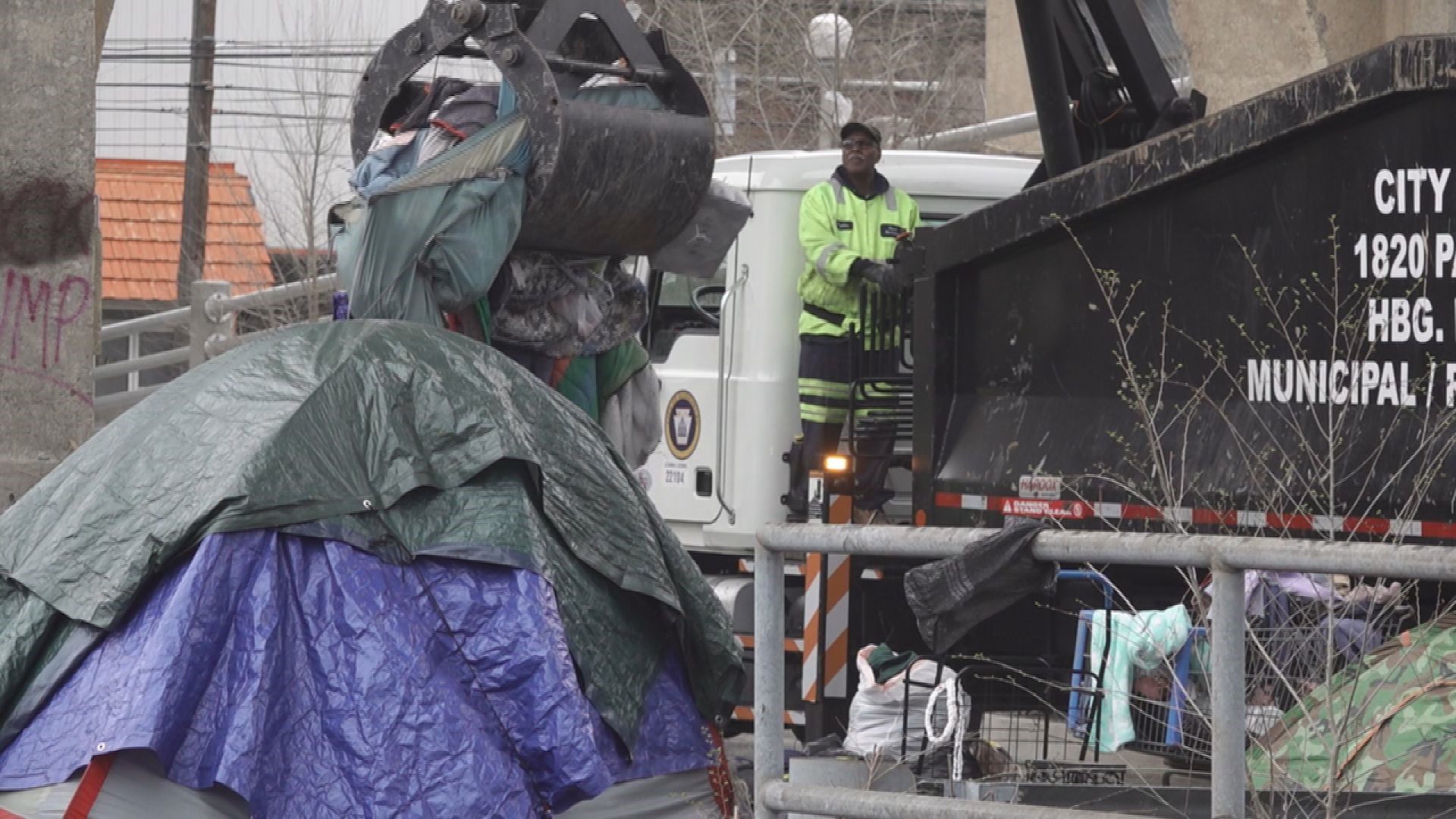 The city's Public Works Department has teamed up with several community groups to clean up the homeless encampment under the Mulberry Street Bridge.