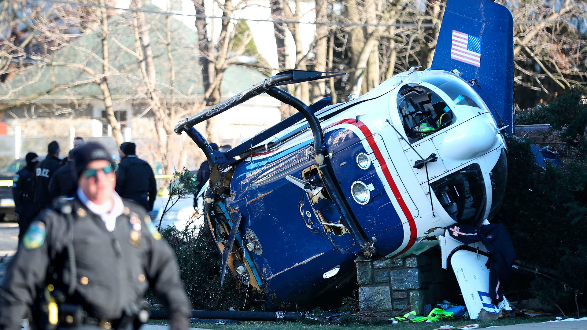 Police say rescue crews rushed to the crash near a church in suburban Philadelphia and helped pull the pilot, two crew members and infant patient from the aircraft.