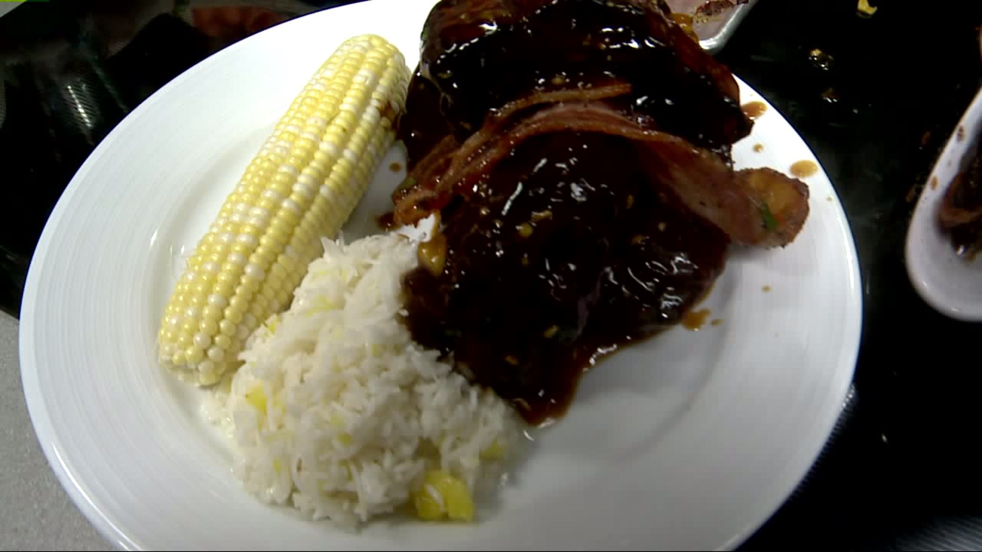 Presentation of Hibachi Baby Back Ribs with coconut ginger sticky rice