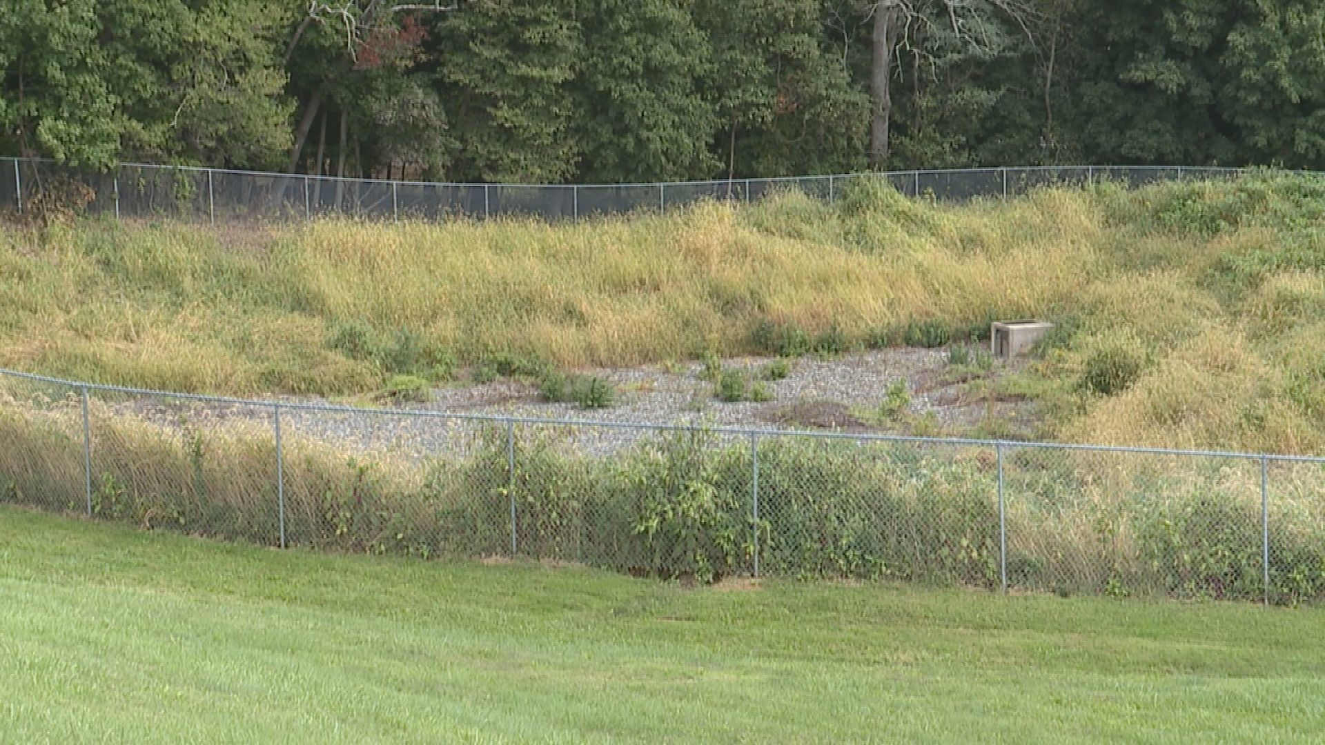 Residents say that a failing stormwater system from a nearby school is to blame.