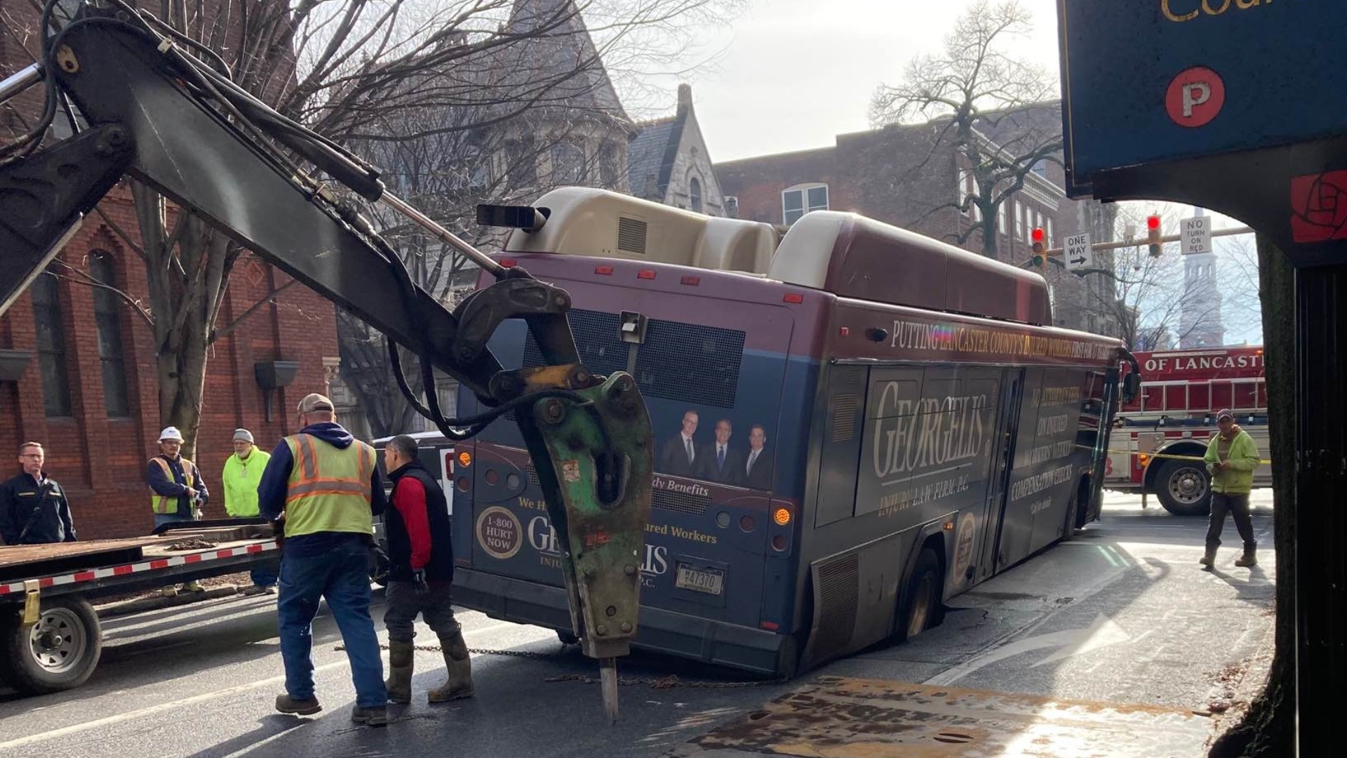 A bus is stuck in a sinkhole along East Orange Street near North Duke Street.