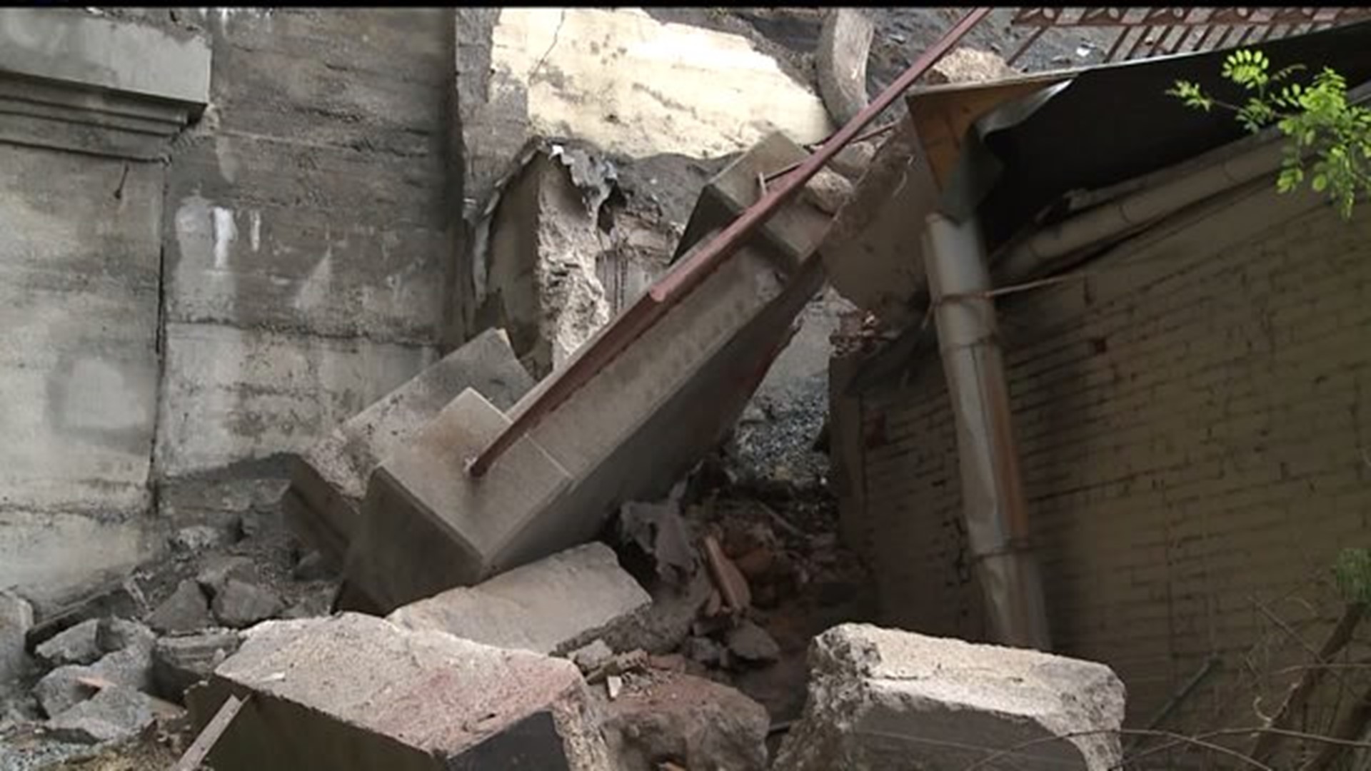 Work begins to determine liability in wall collapse