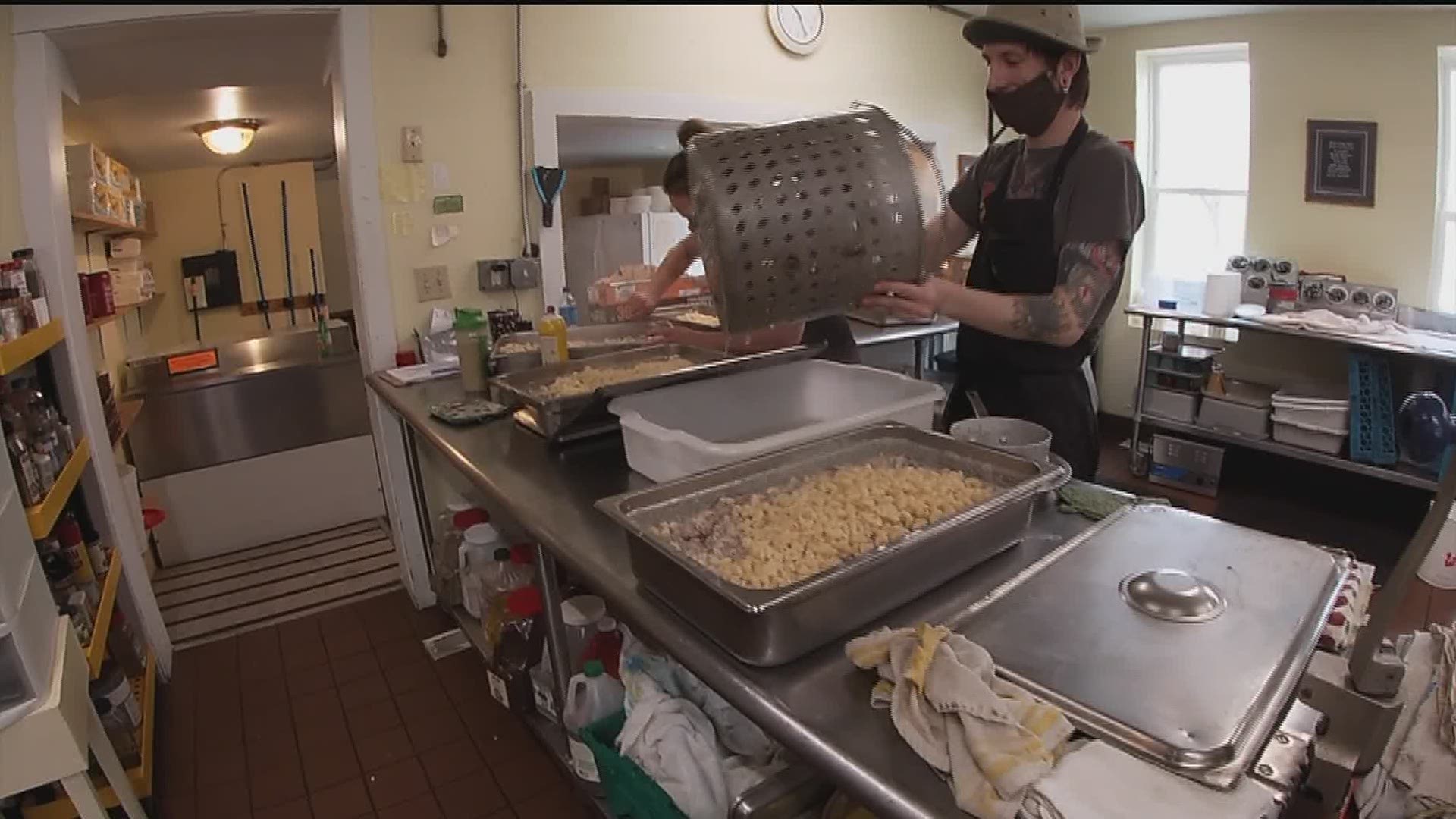 Cafe on Vine has had to serve 100 meals more each day to feed the QC homeless population staying in nearby hotels.