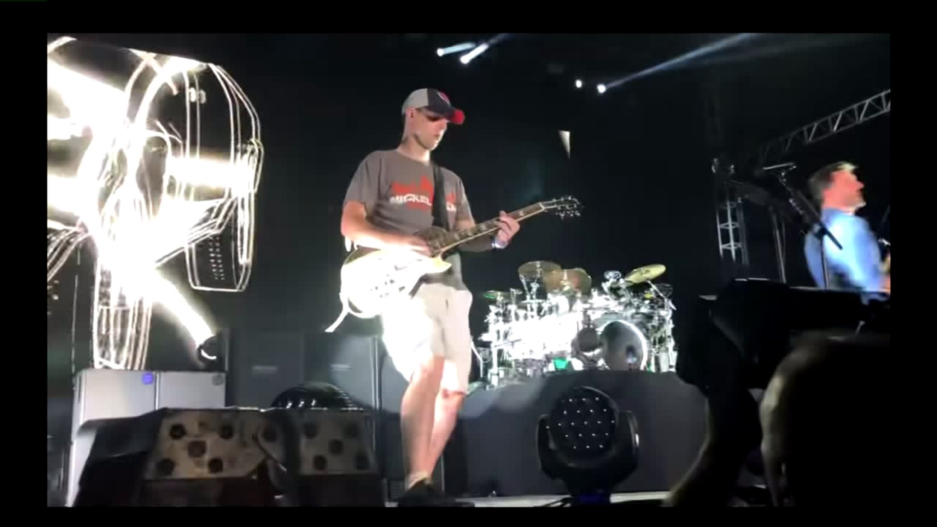 Nickelback fan goes up on stage to play with band for the (second) chance  of a lifetime 