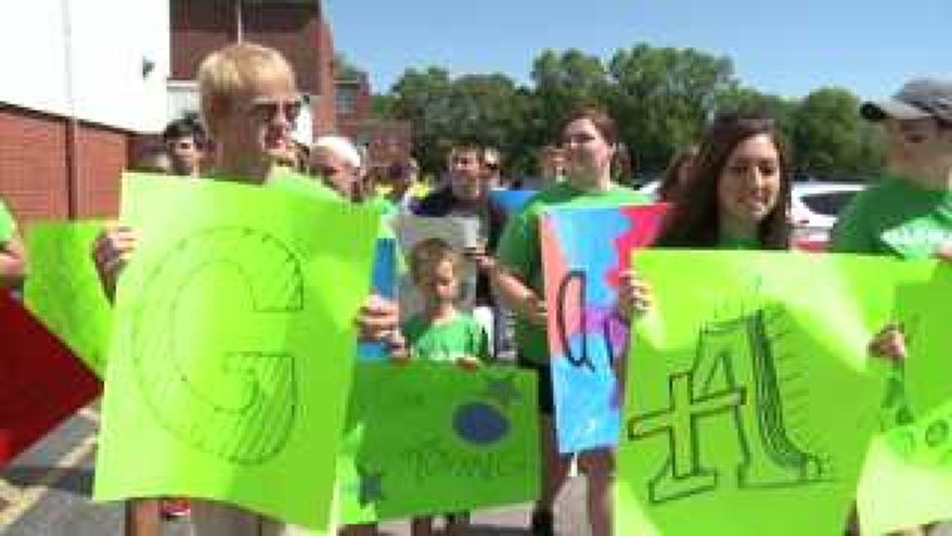 Alleman family rallies for dismissed assisant principal
