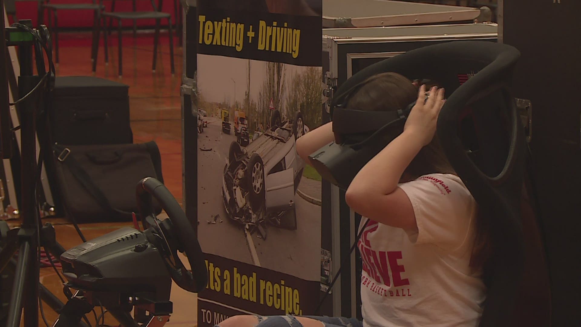 Students at United Senior High School use an impaired driving simulator just one day before their prom.
