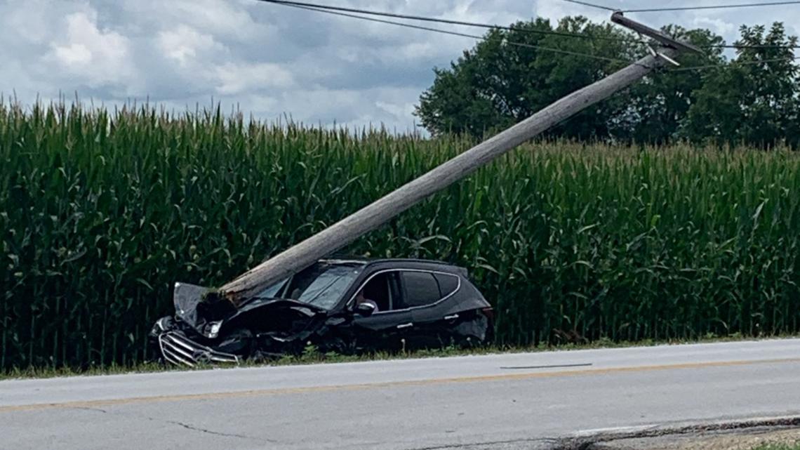 Car strikes power pole after collision with MidAmerican Energy vehicle ...