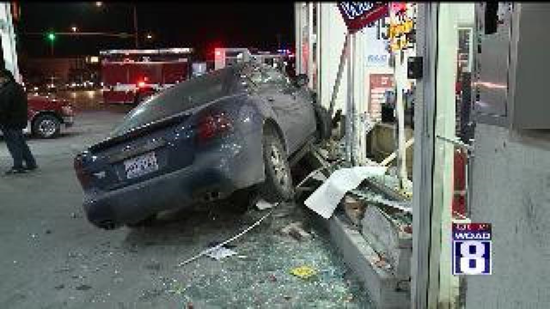 Car crashes through gas station window