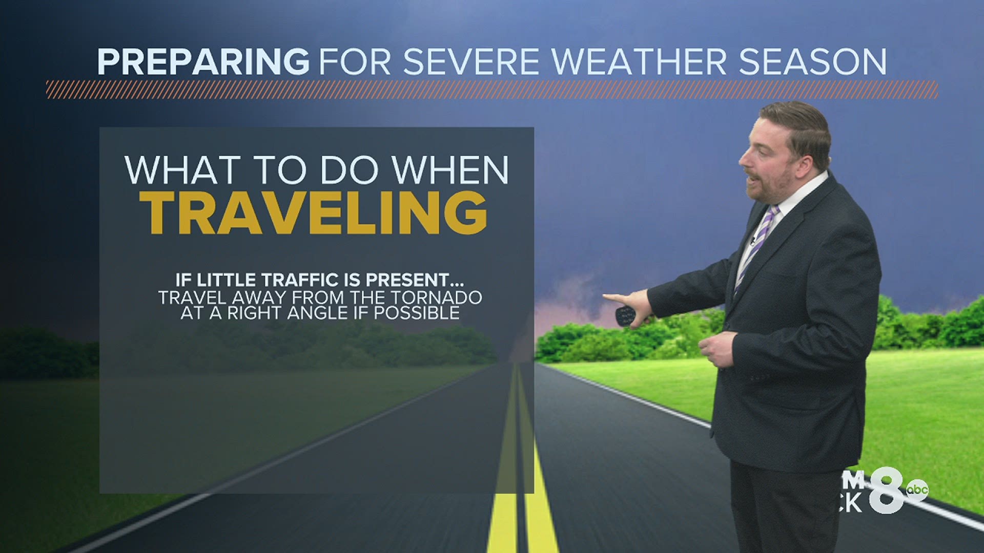 What should you do if you encounter a tornado while traveling in a vehicle?