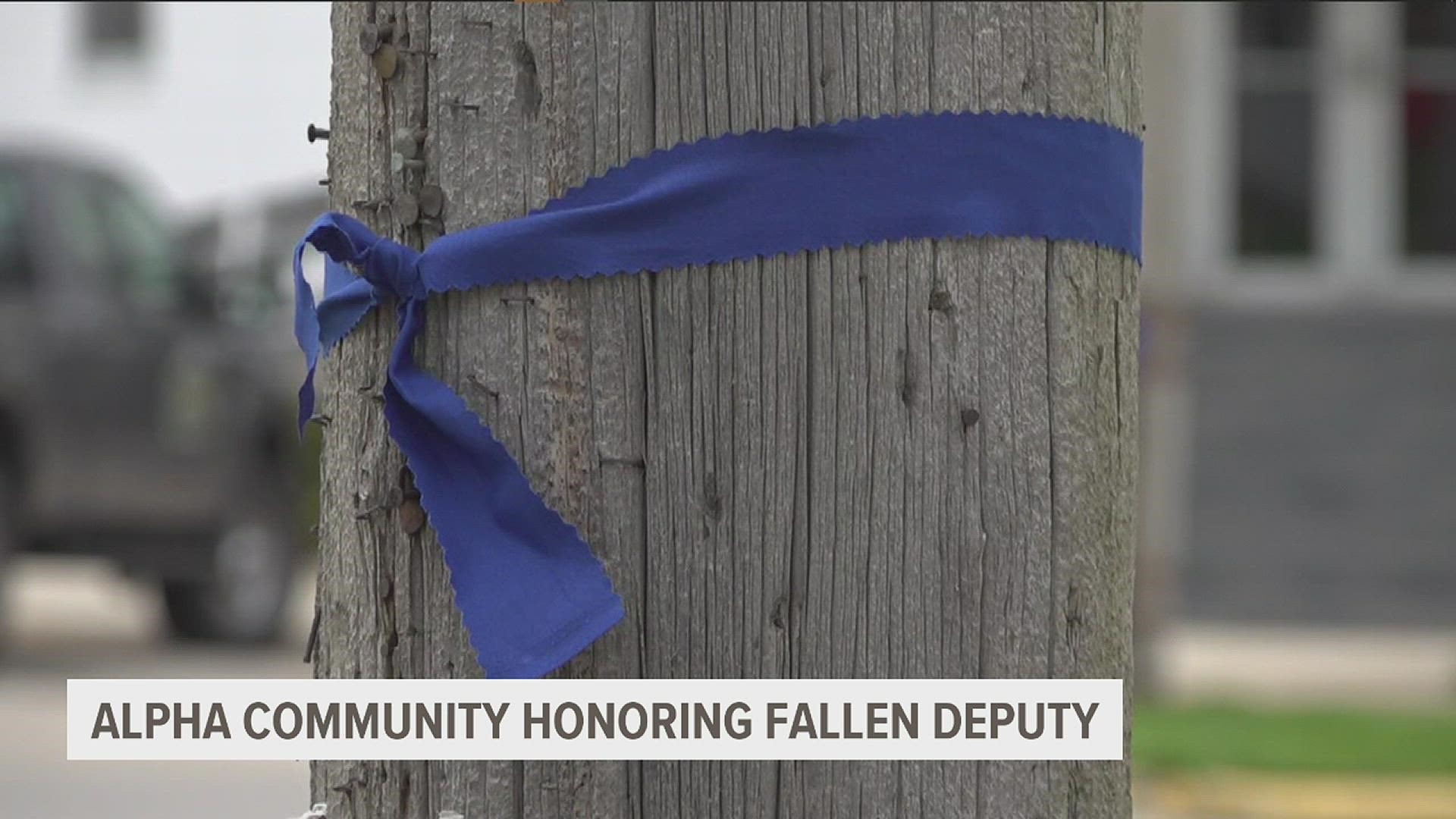 Community members in Alpha, Illinois, gathered for a blue ribbon ceremony to honor Nicholas Weist, a Knox County Sheriff's deputy killed in the line of duty,