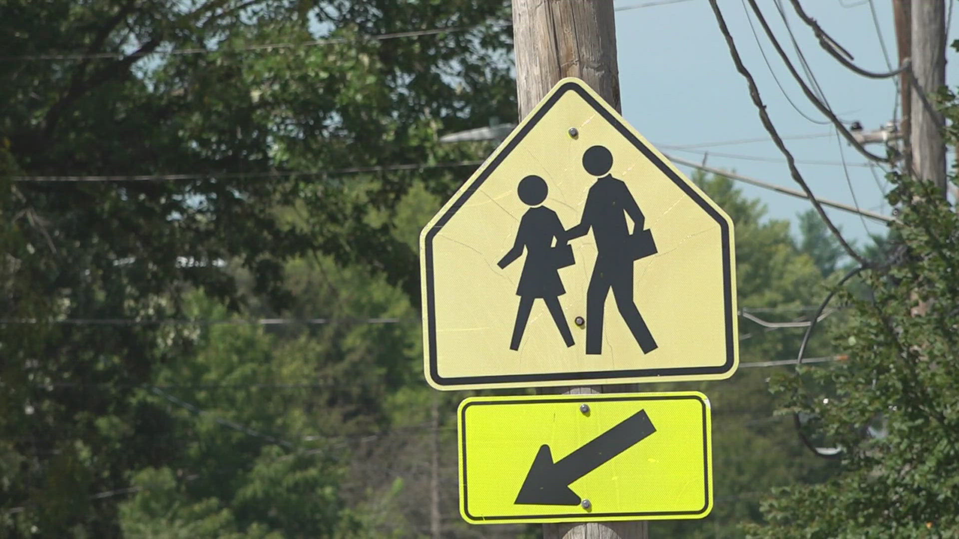 Police officers were posted at Eisenhower Elementary on Friday to remind people to slow down as students headed back for the first day of classes.