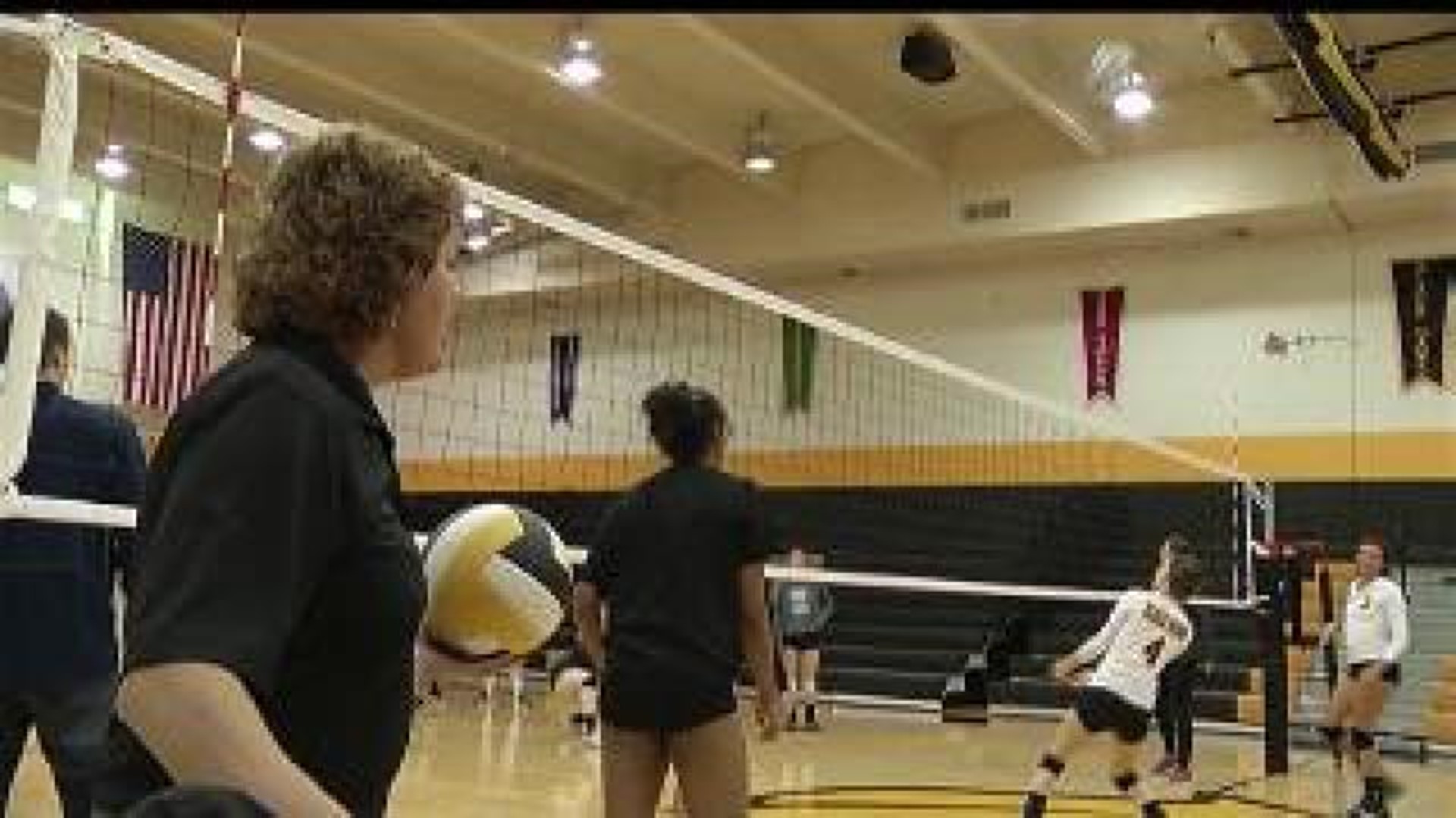 Volleyball coach battling cancer finds support in team