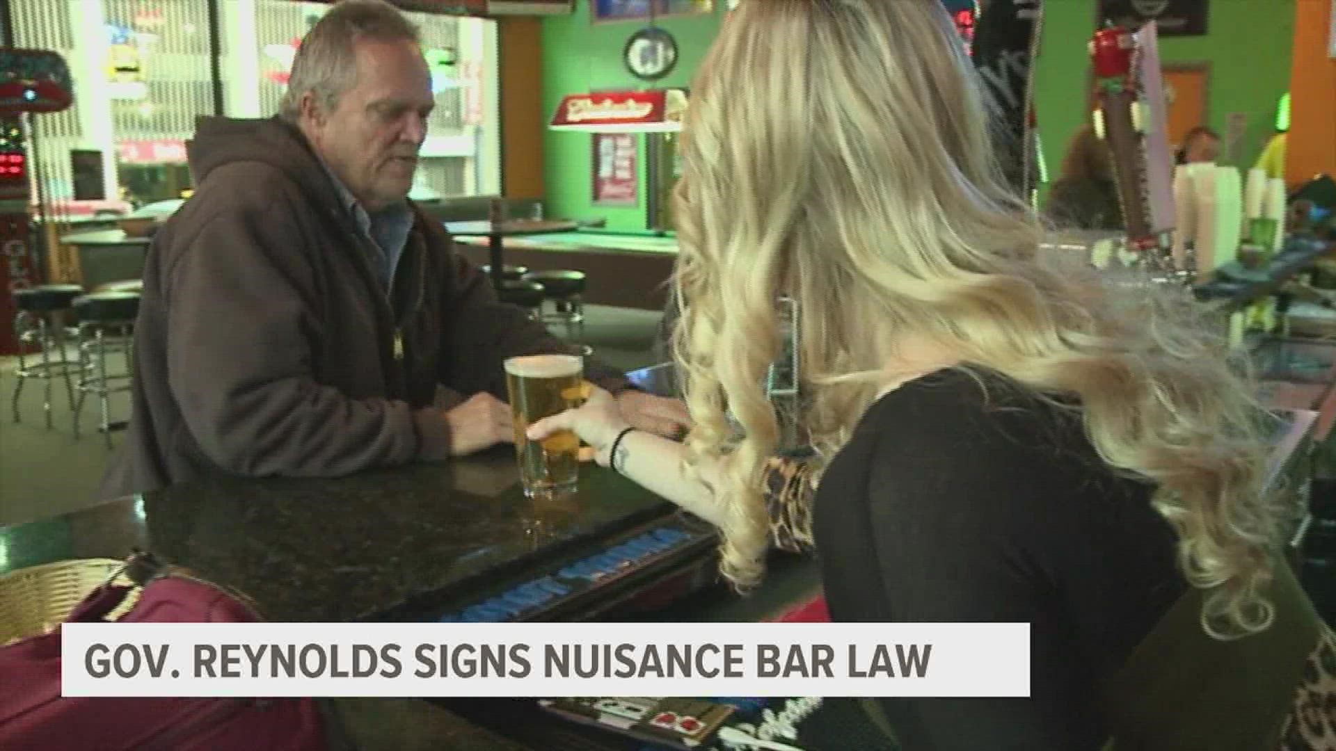 Gov. Kim Reynolds signed a bill that makes it so Iowa cities and counties don't have to rely on state regulators to take licenses away from nuisance bars.