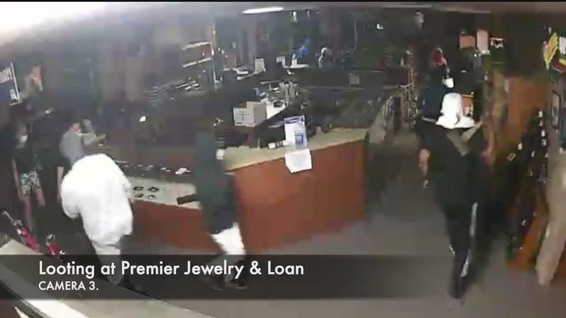 Surveillance video captures looting at QC Pawn Shop