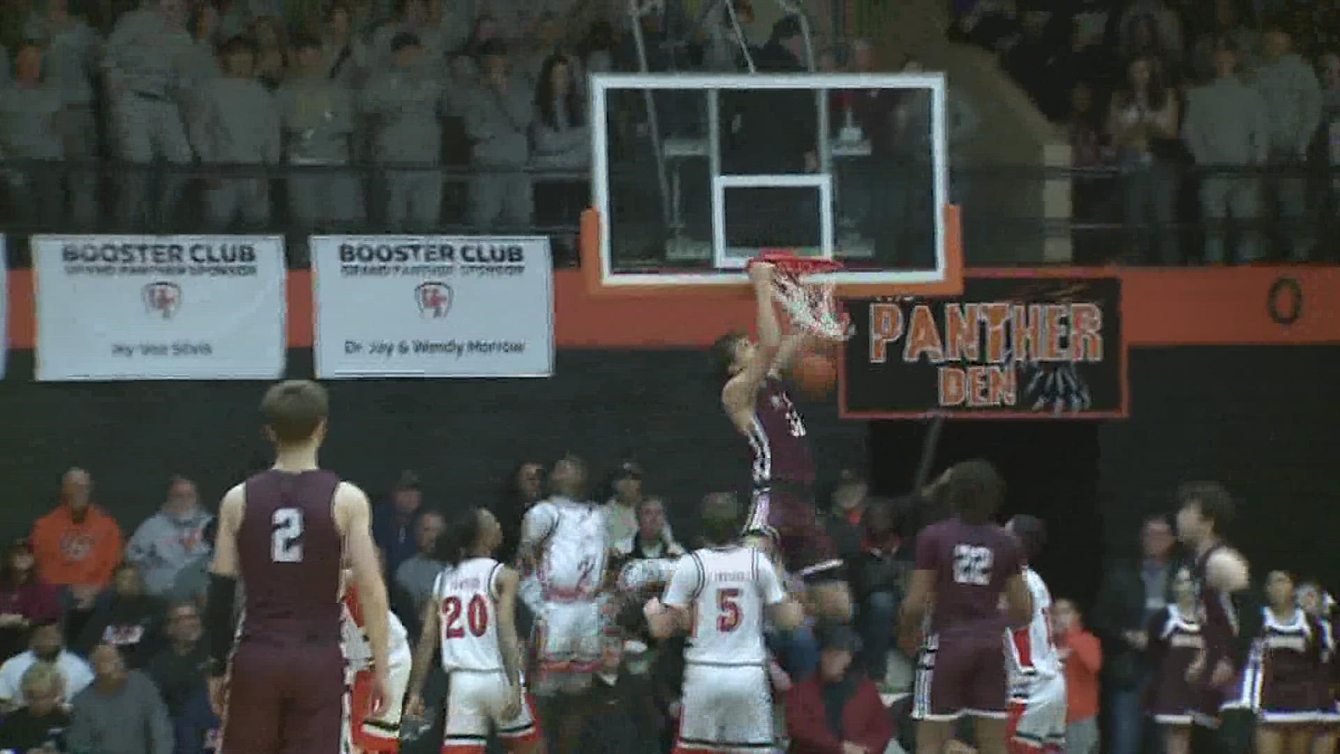 Owen Freeman dunks on United Township during Week 1 of Quad Cities high school basketball.