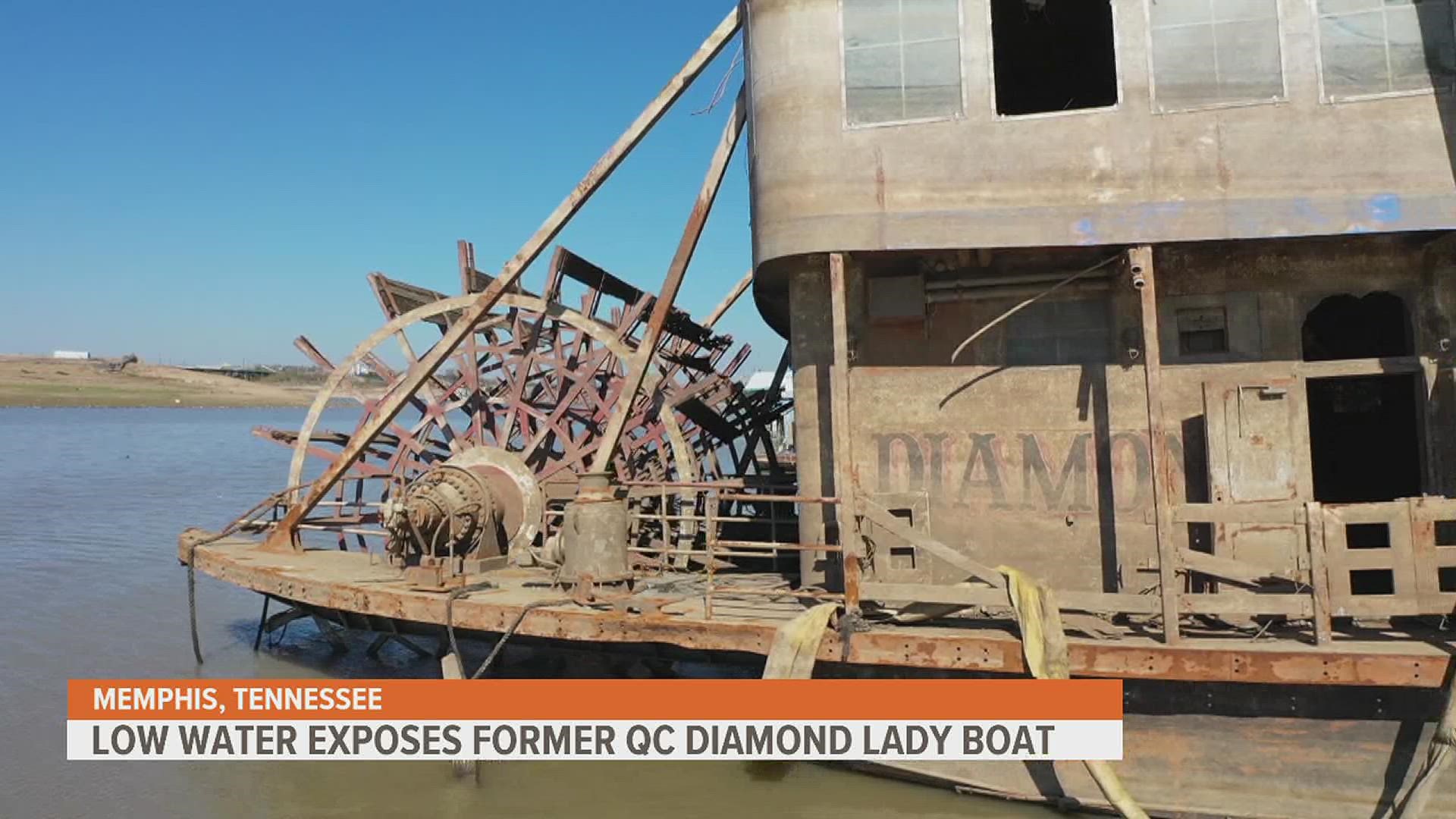 The historic gambling riverboat christened in Bettendorf, Iowa during the early 90s is now fully exposed due to the low water levels, revealing extensive damage.