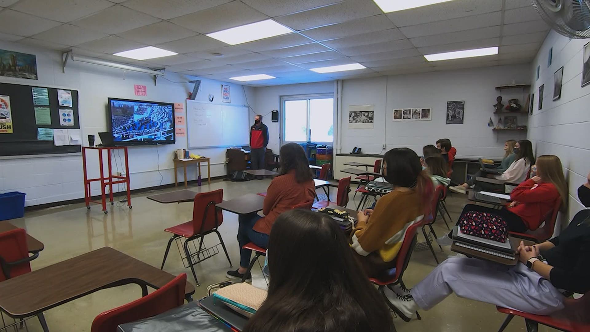 About a dozen students watched part of President Biden's inaugural address, as part of their political science class at Orion High School.