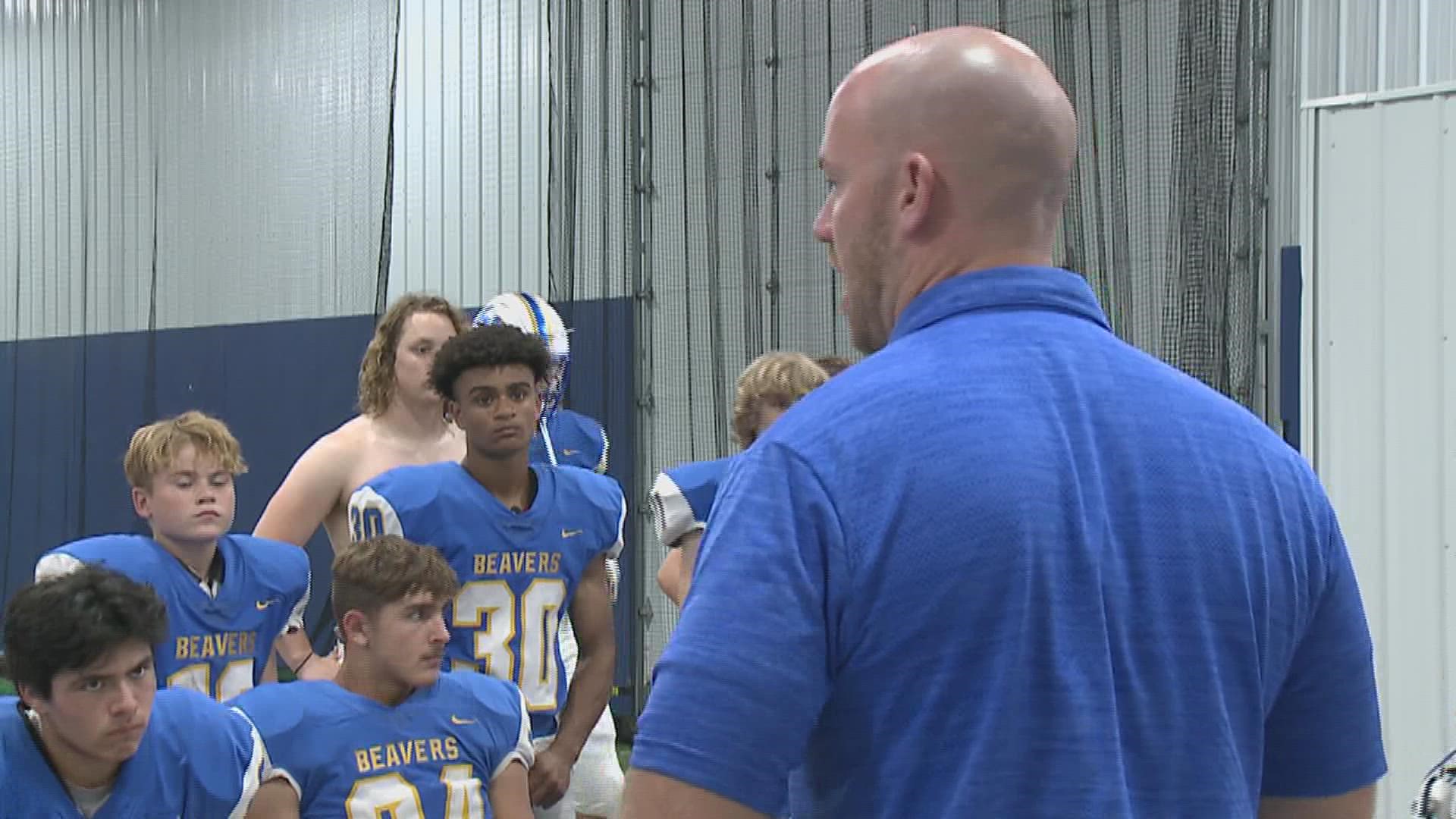 Wilton head coach Ryan Hetzler gives his Beaver team a pregame motivational speech as they take on Durant in week 4.