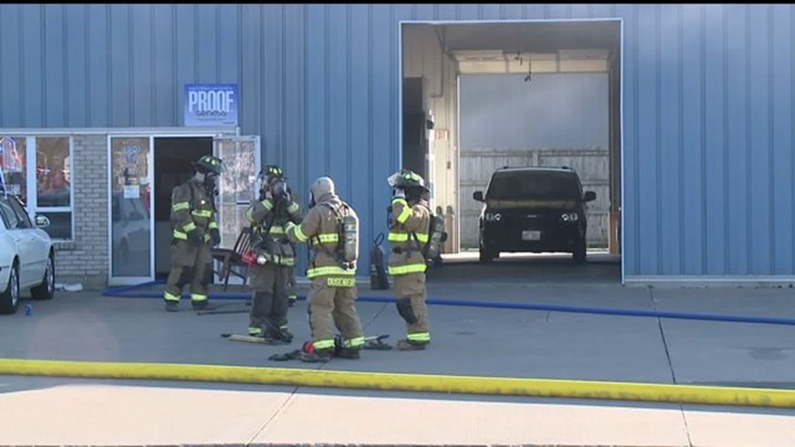 Fire erupts at collision repair shop in Moline