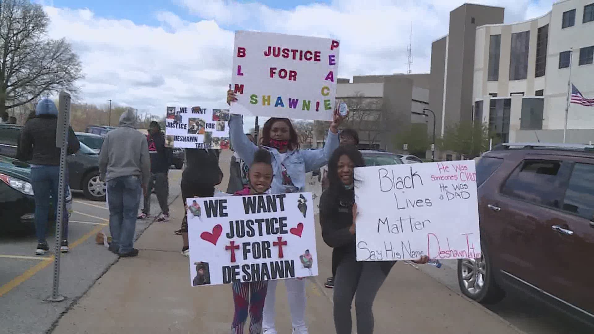 In the wake of a deadly officer-involved shooting, people gathered at the Rock Island Police Department and the Rock Island County Justice Center Monday morning.