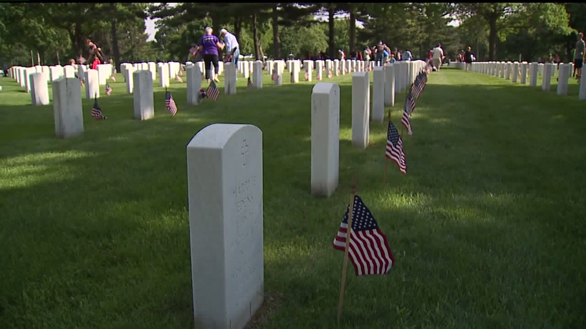 volunteers needed to place flags on tombstones for Memorial Day