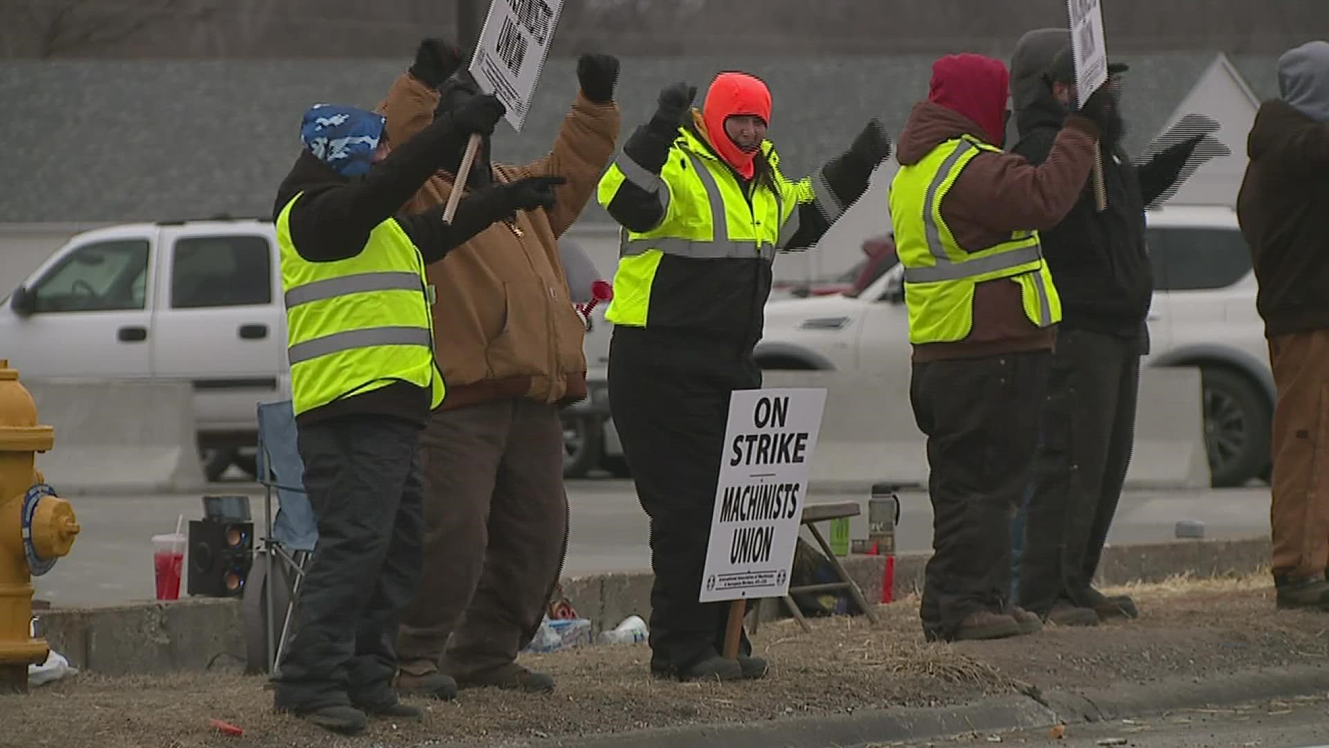 IAM Union members say a city ordinance prevents picketers from having fires, tents and port-a-potties. To help, some workers have been dancing the cold away.