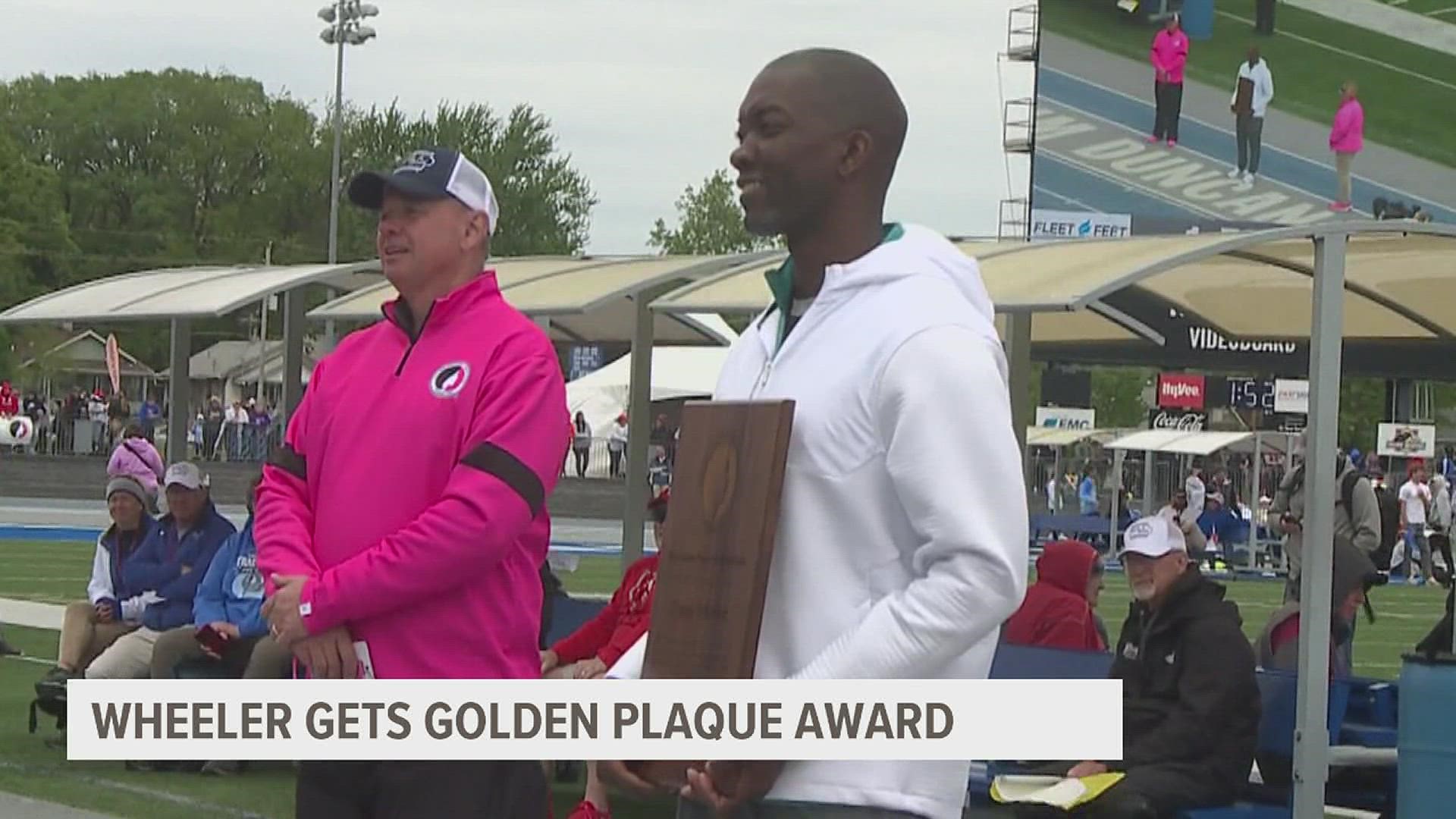 Pleasant Valley Girls Track Coach Kenny Wheeler receives the Golden Plaque Award.