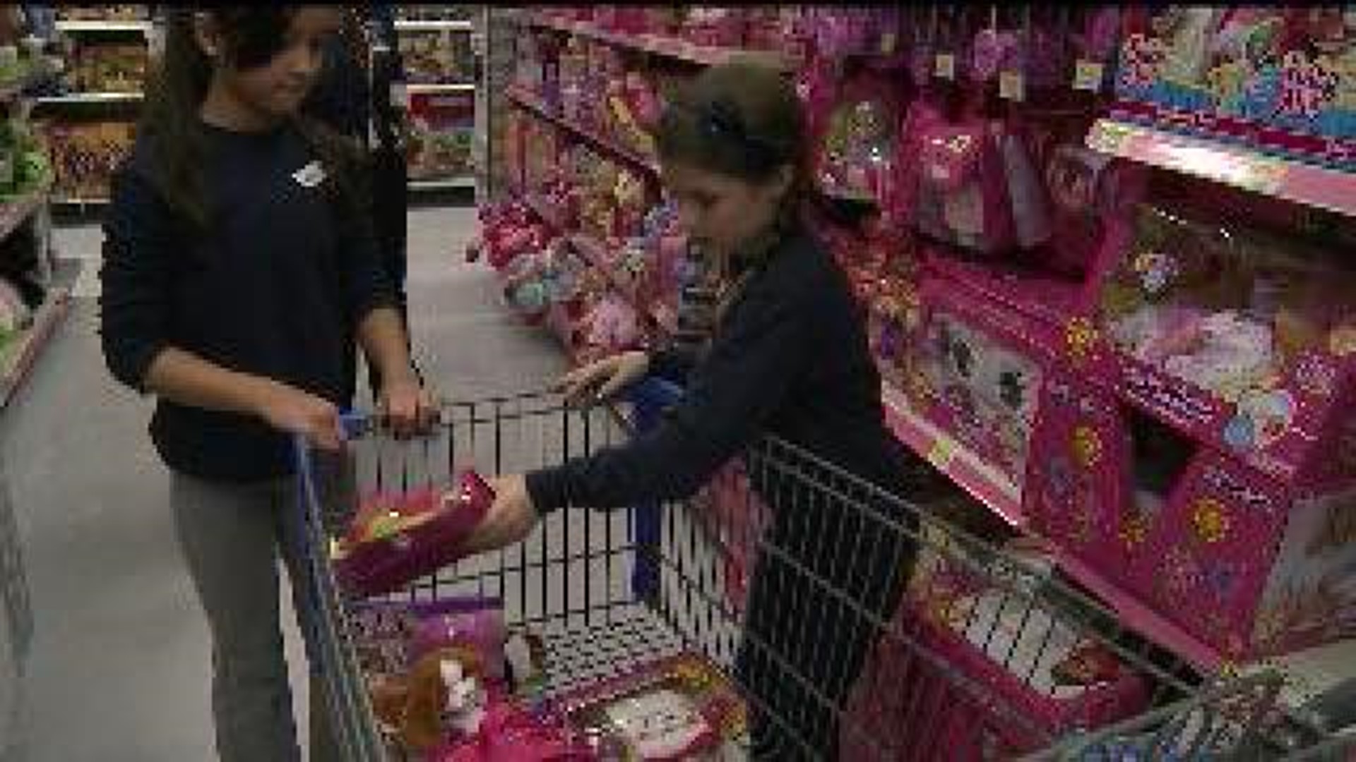 Kids shop for Toys for Tots