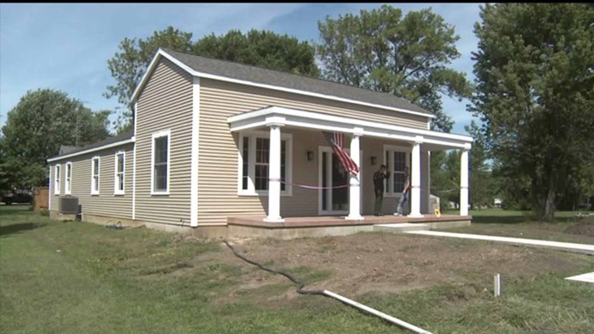 Soldier and his family move into home built by volunteers