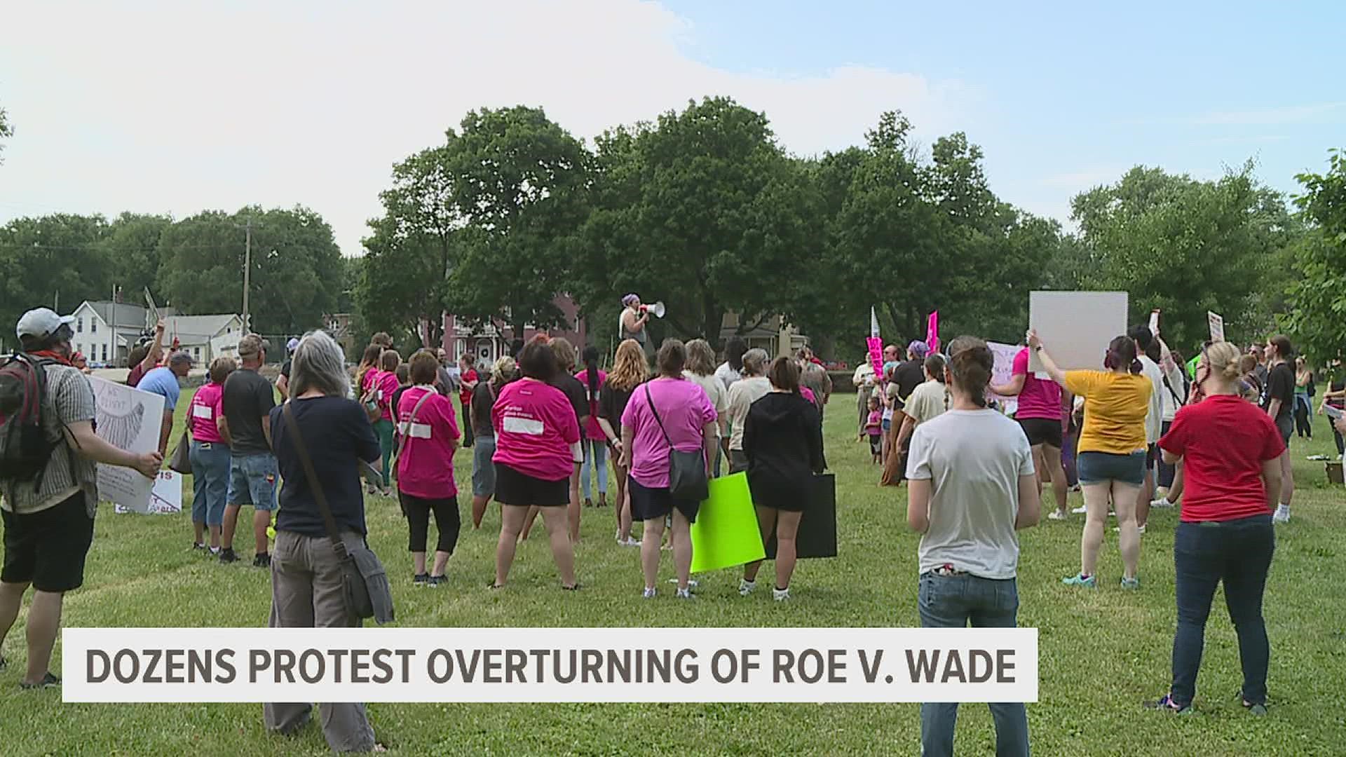Around 100 people gathered in Layafette Park in Davenport Saturday afternoon carrying signs and speaking out against the Supreme Court's decision.