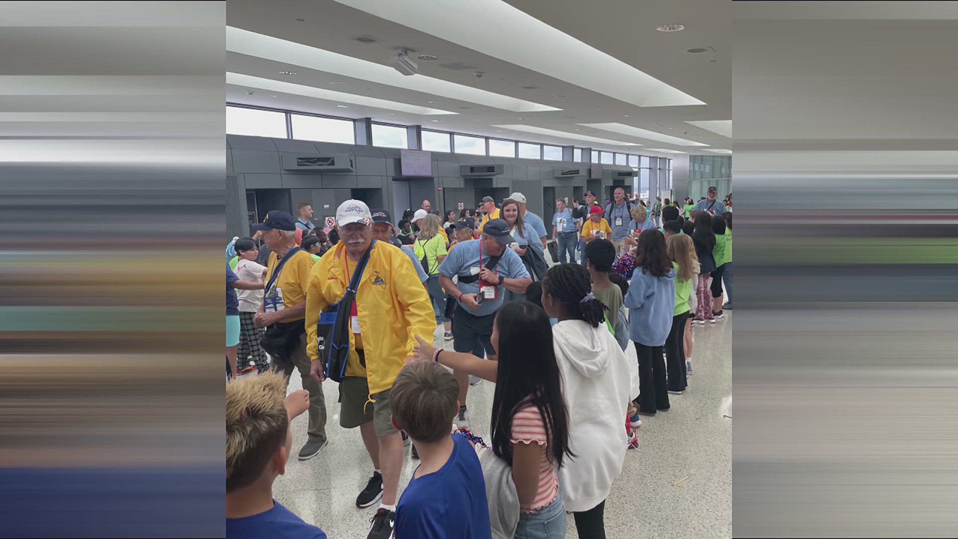 Four buses of school kids had signs, flags and lots of cards for 80 veterans on today's Hy-Vee Honor Flight of the Quad Cities.