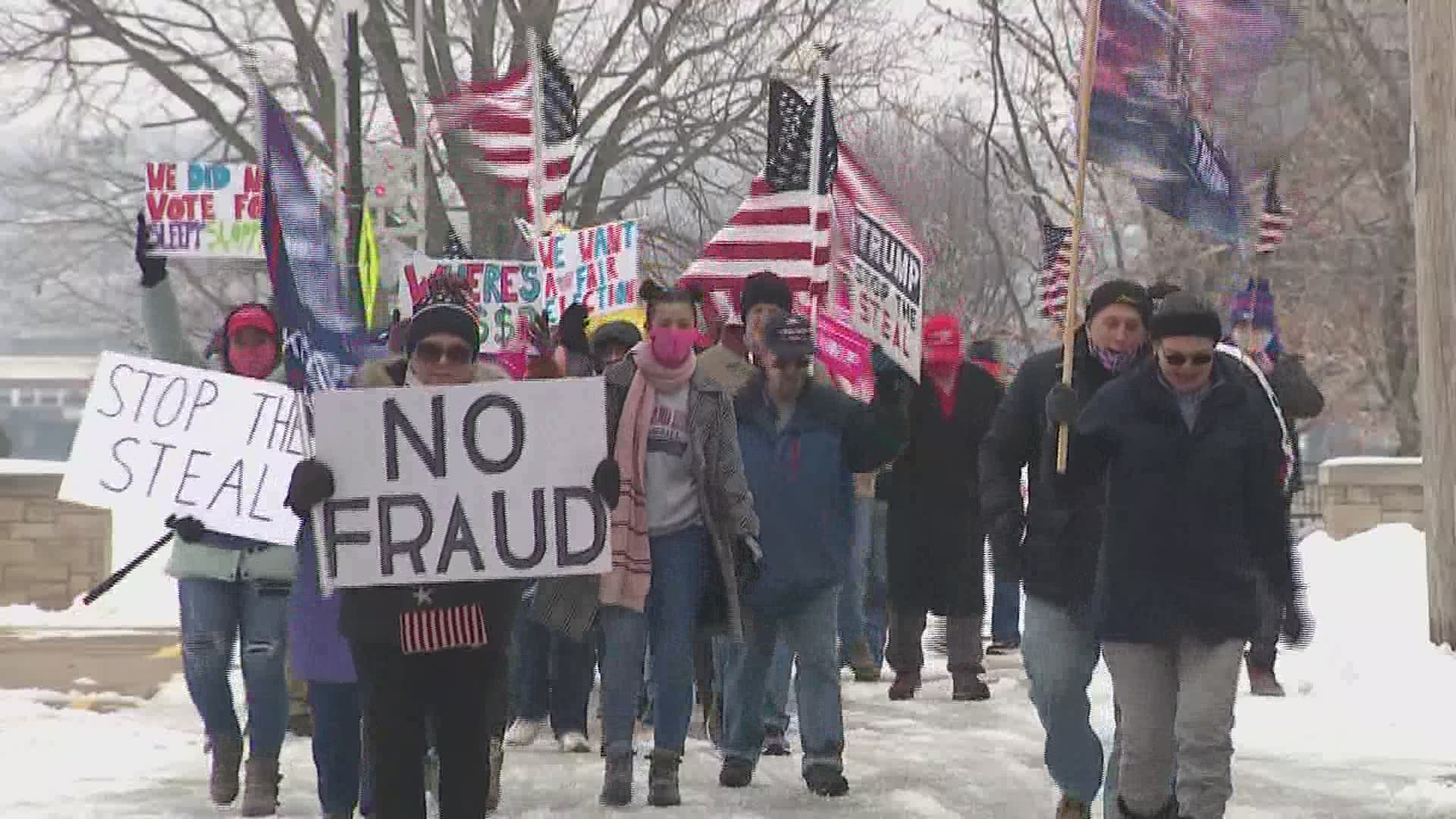 Roughly two dozen protestors gathered carrying signs and shouting slogans like "Stop the Steal," echoing the president's claims that the election was rigged