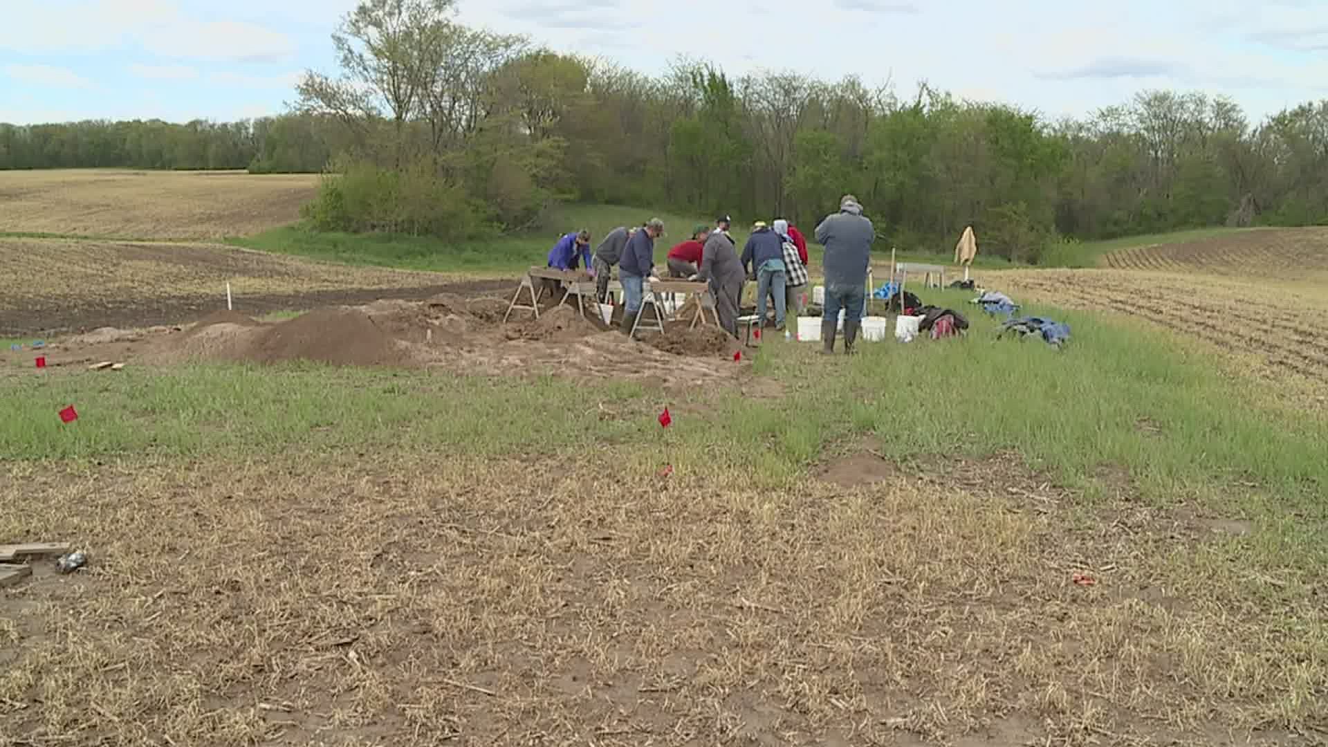 Tom Loebel and a group of about a dozen volunteers spent Sunday sifting through a Quad Cities field, hoping to find artifacts dating back more than 9,000 years.