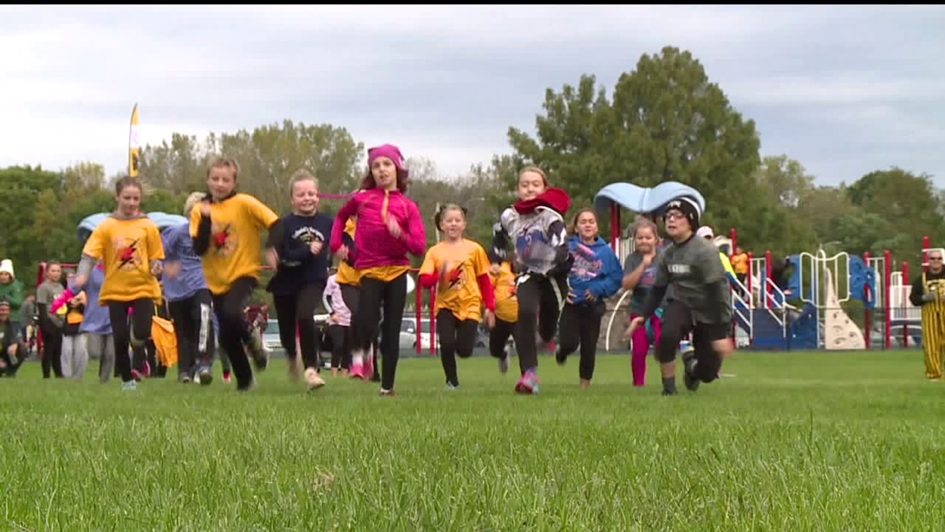 Mini-heroes and their parents get moving for Down Syndrome awareness and fundraising