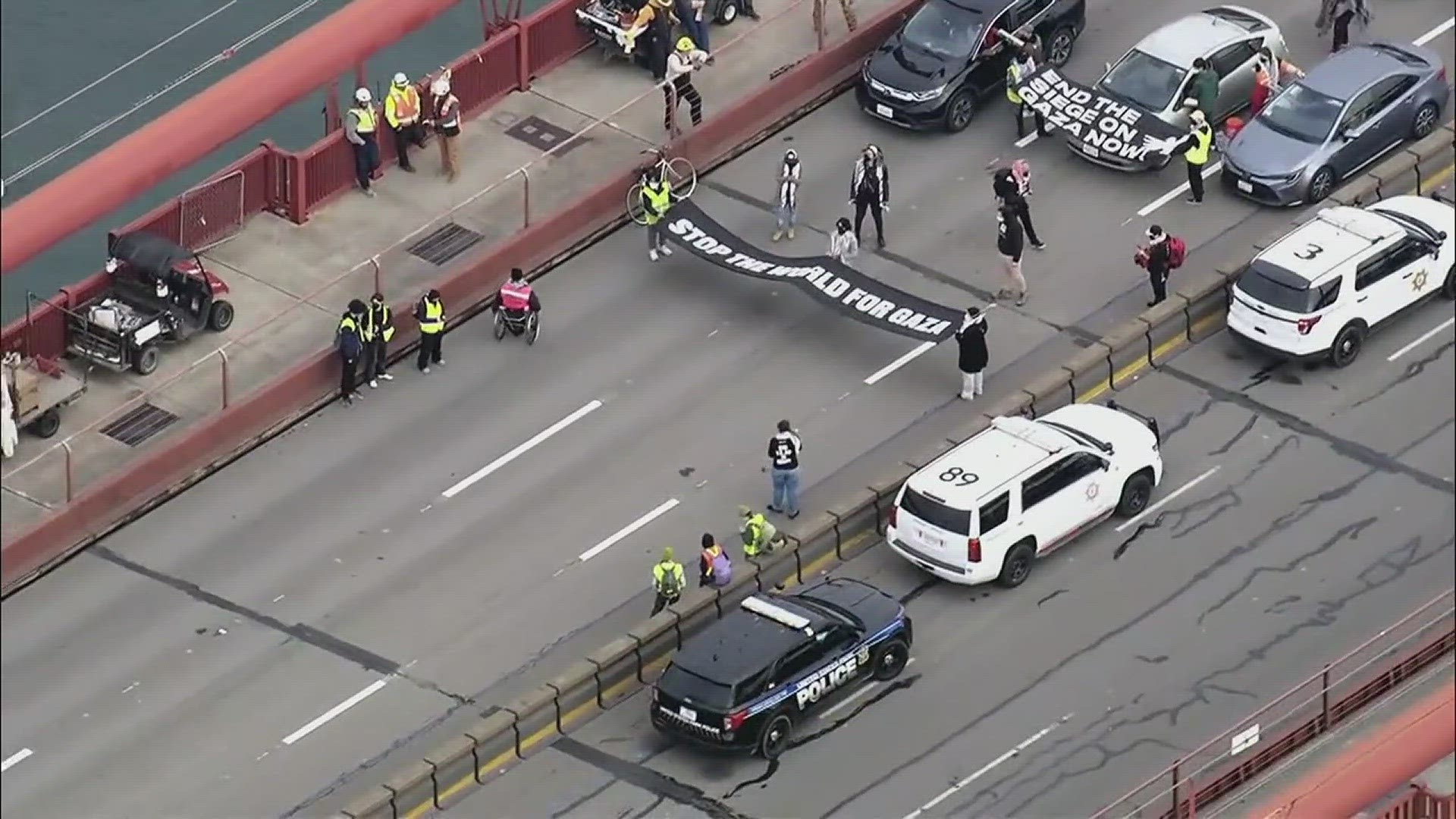 Some protesters on the Golden Gate Bridge held a black banner that read “Stop the world for Gaza.”