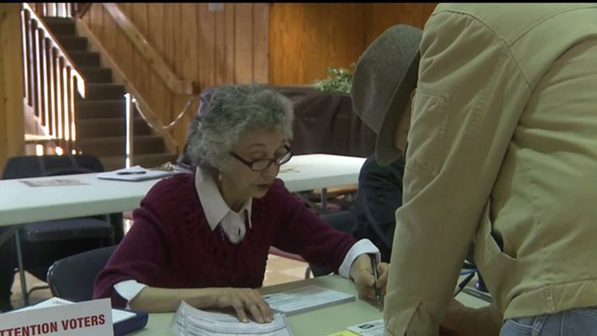 Volunteers help voters understand write-in ballots