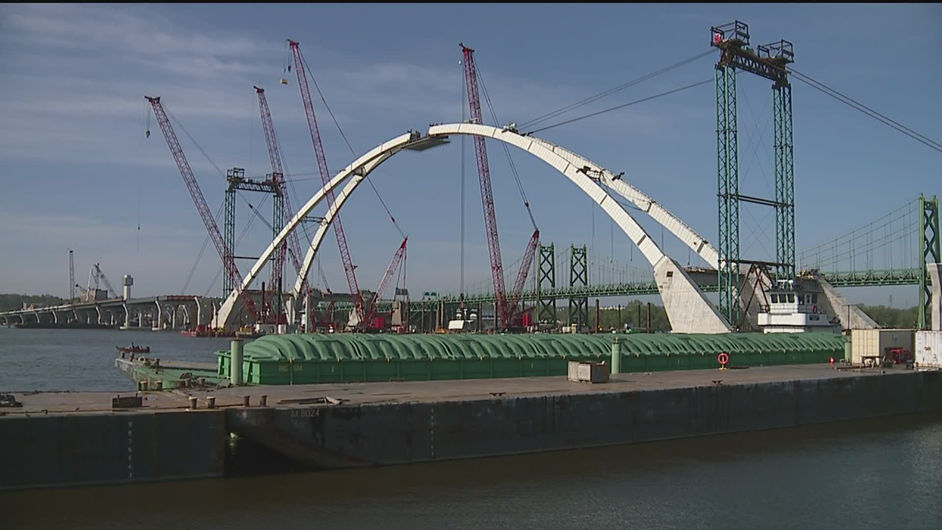 The keystone piece to the first arch of the new I-74 bridge is now in place, but it's not done yet.